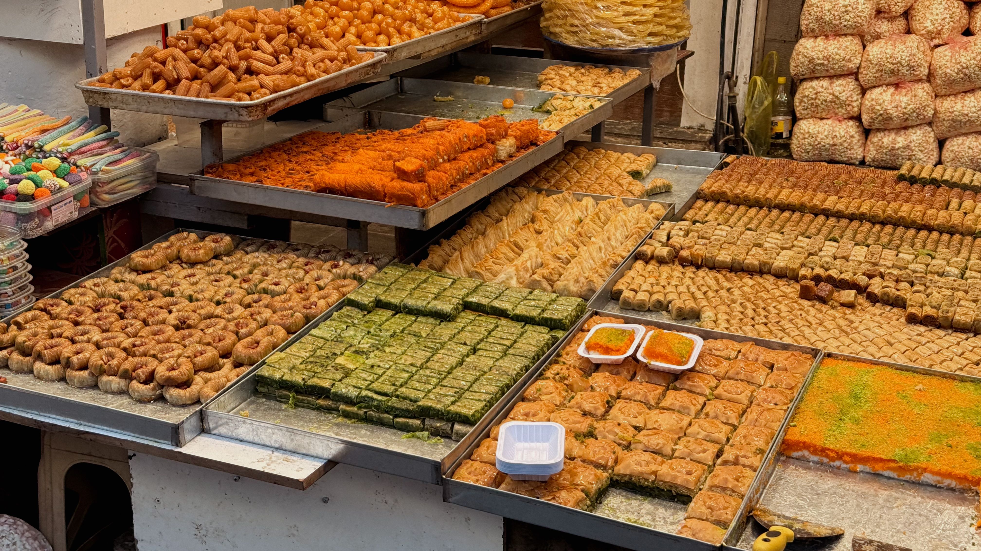 Savoring traditional sweets in Baghdads lively market