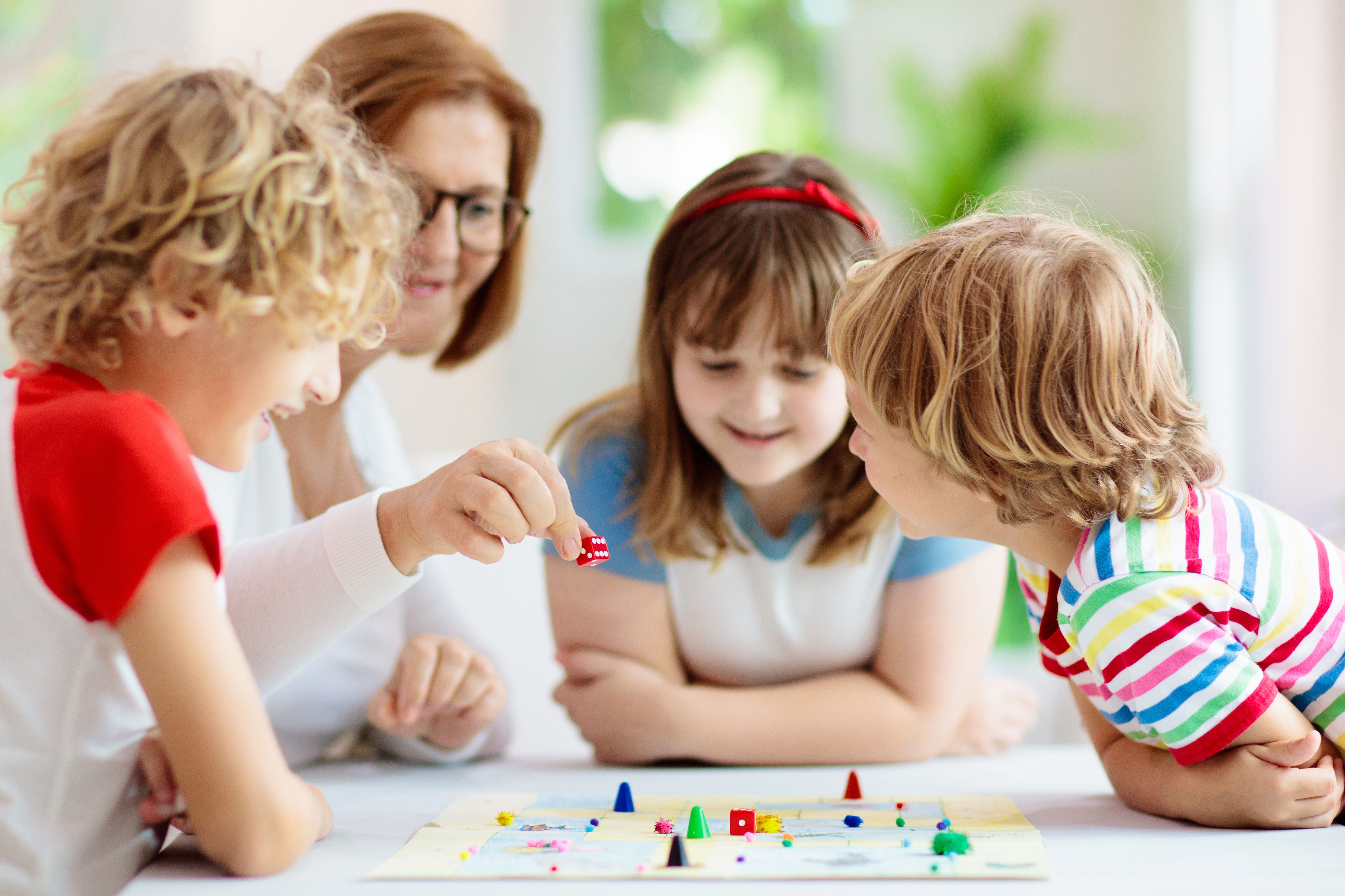family playing board game