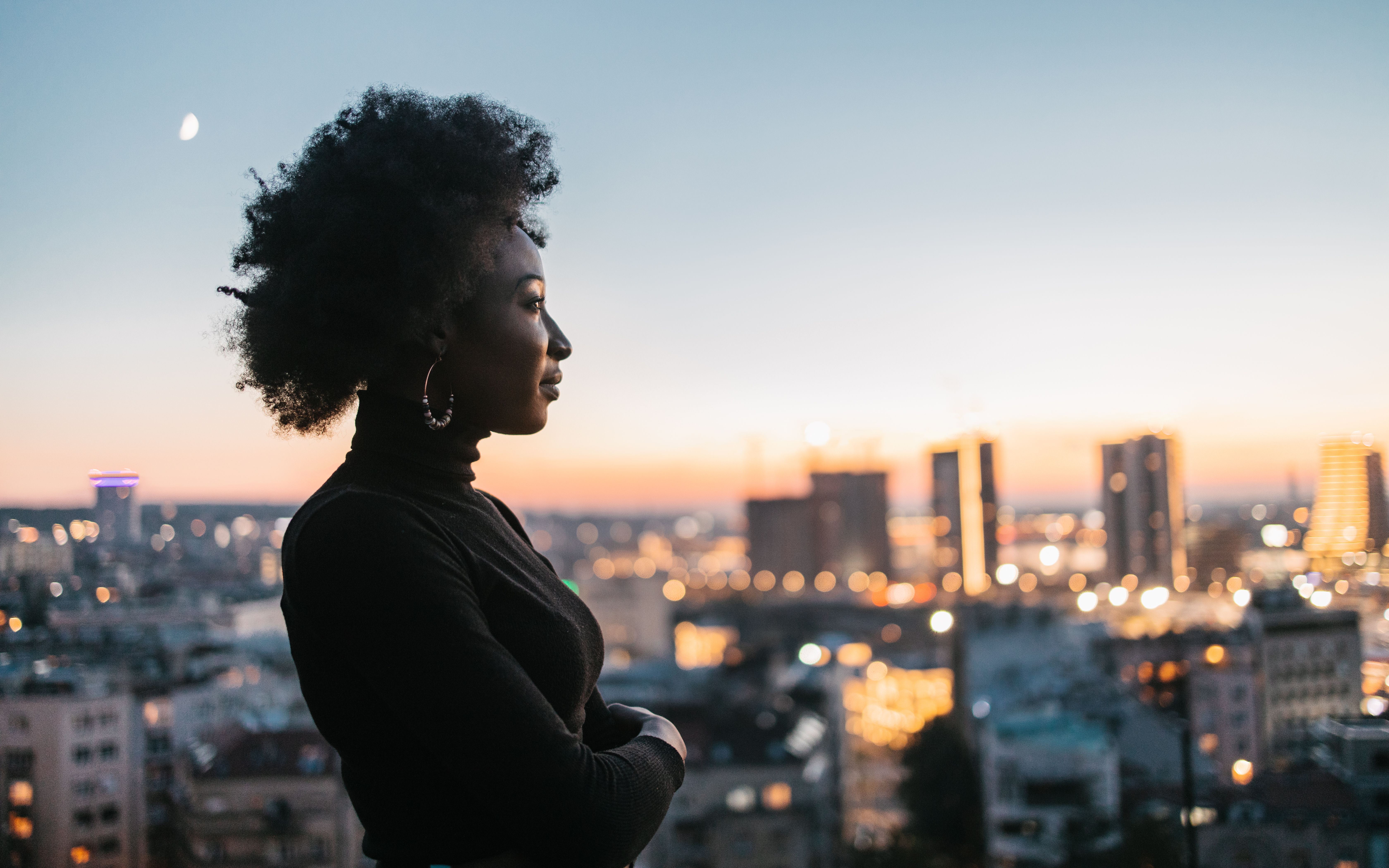 African woman looking at the city view