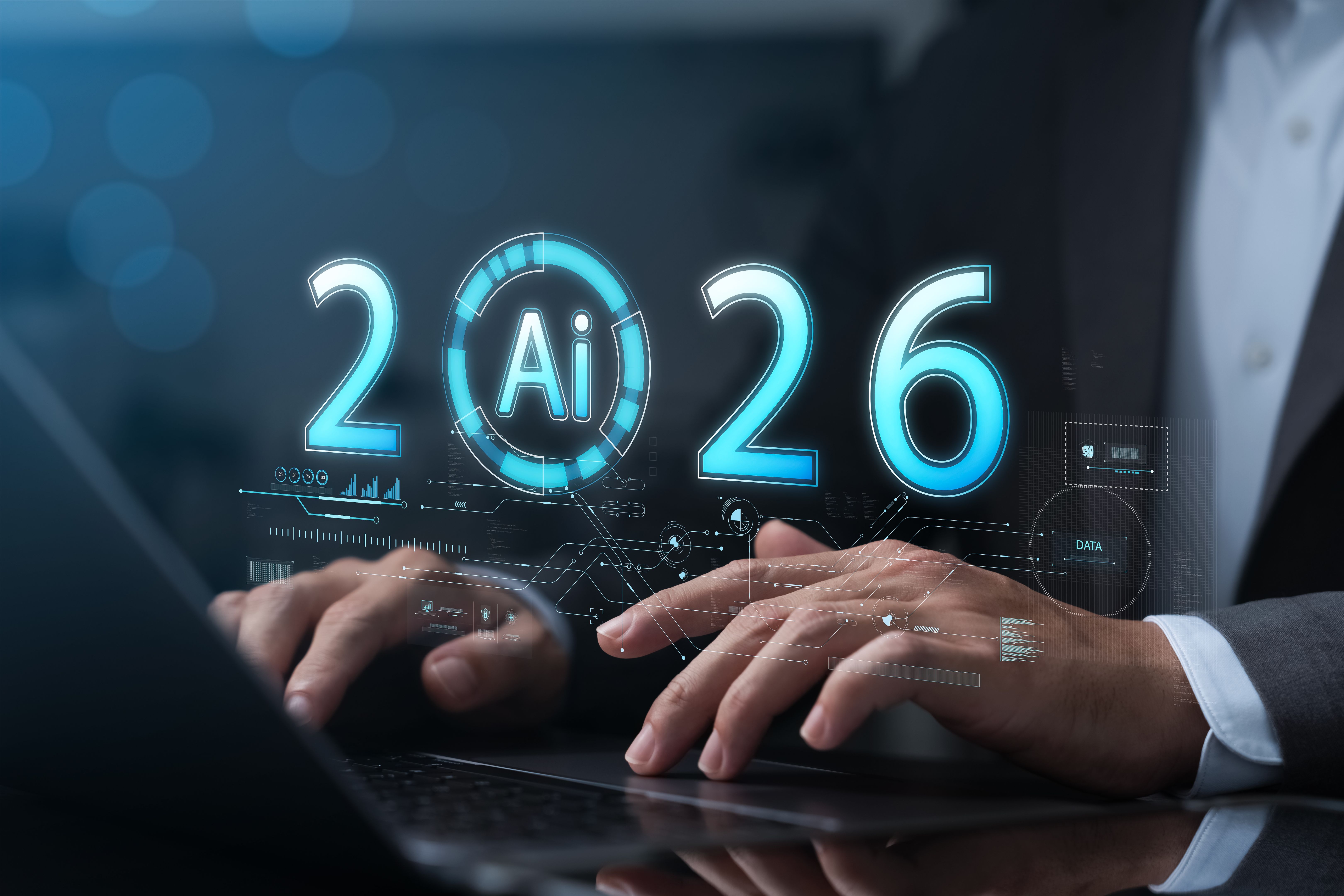 Businessman using laptop with AI 2026 hologram interface showing futuristic technology, innovation, artificial intelligence, data analysis, digital transformation, machine learning trends.