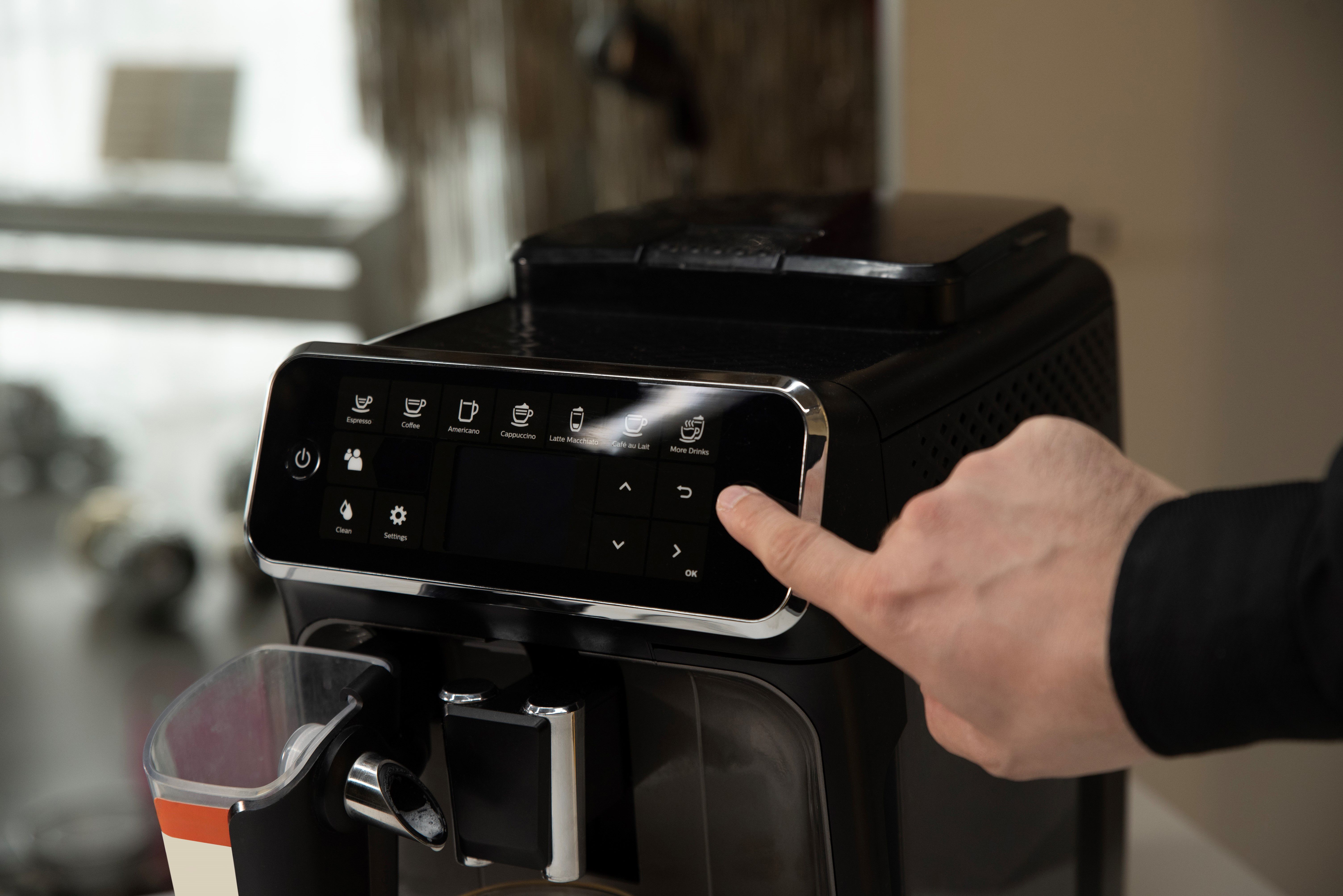 user using coffee machine