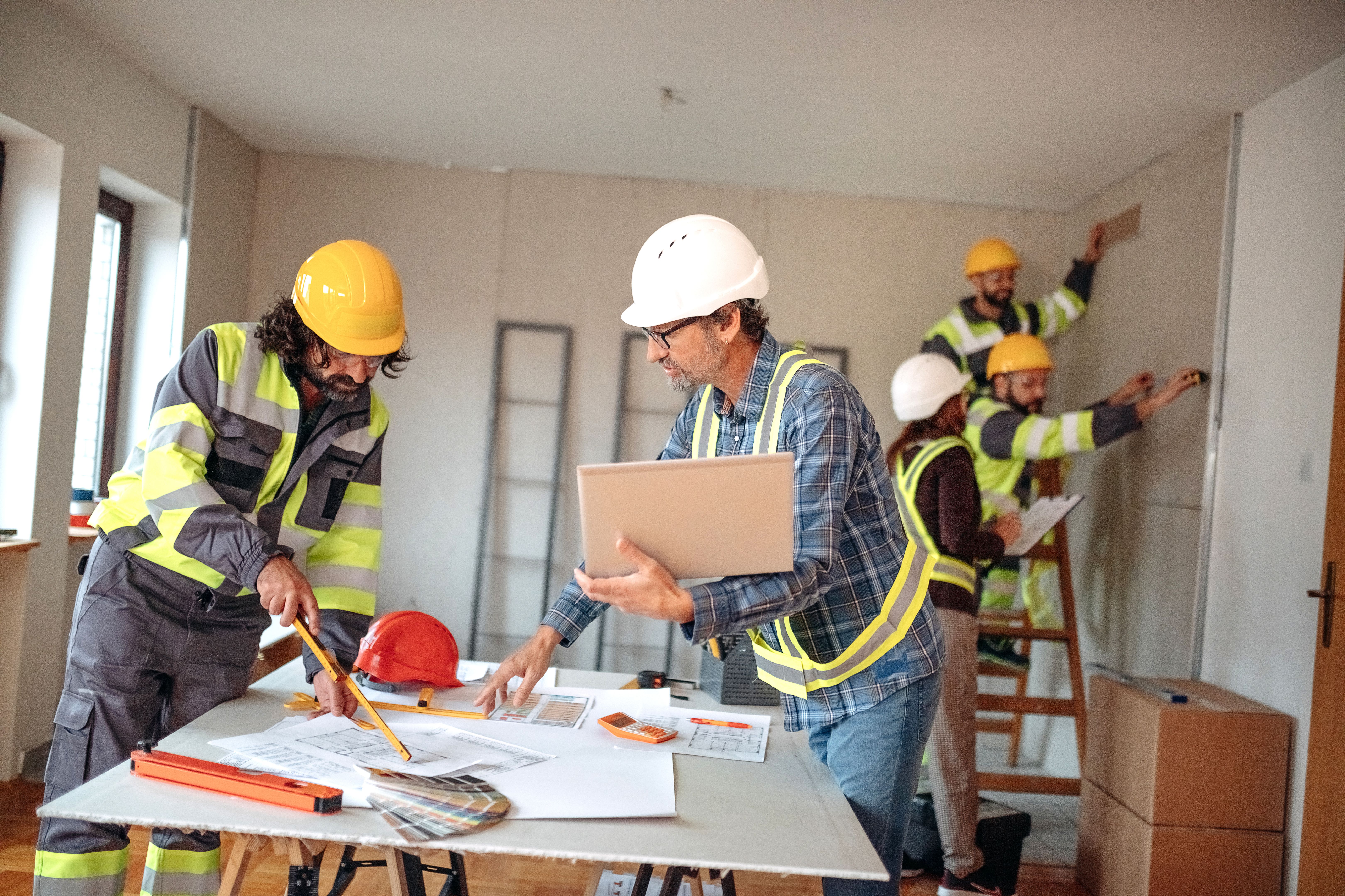 Team working on interior design on a meeting at site