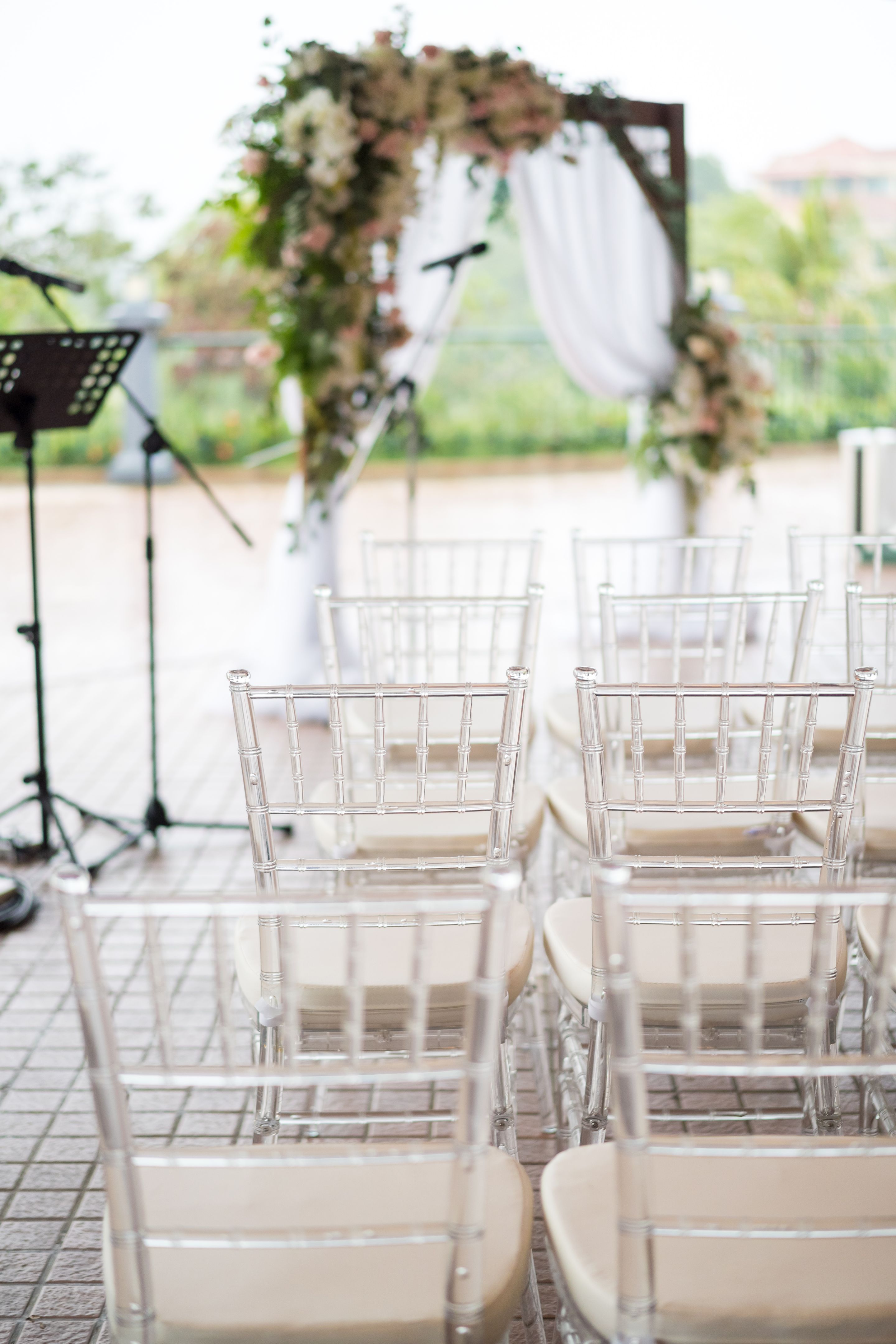 Rows of transparent chairs at open space wedding ceremony Rows of transparent chairs at open space wedding ceremony