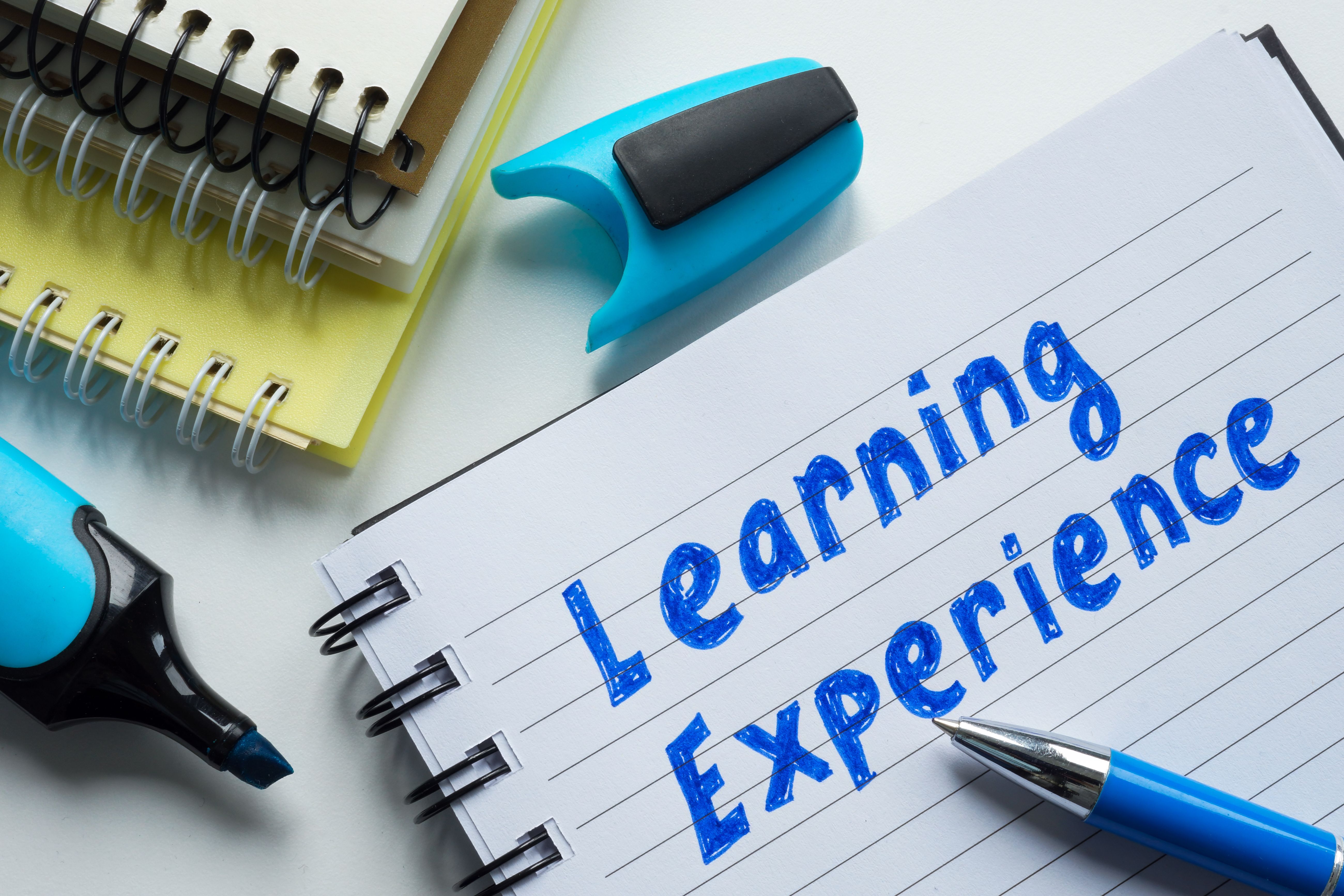 Notes in a notebook about learning experience. Personal growth and knowledge acquisition.