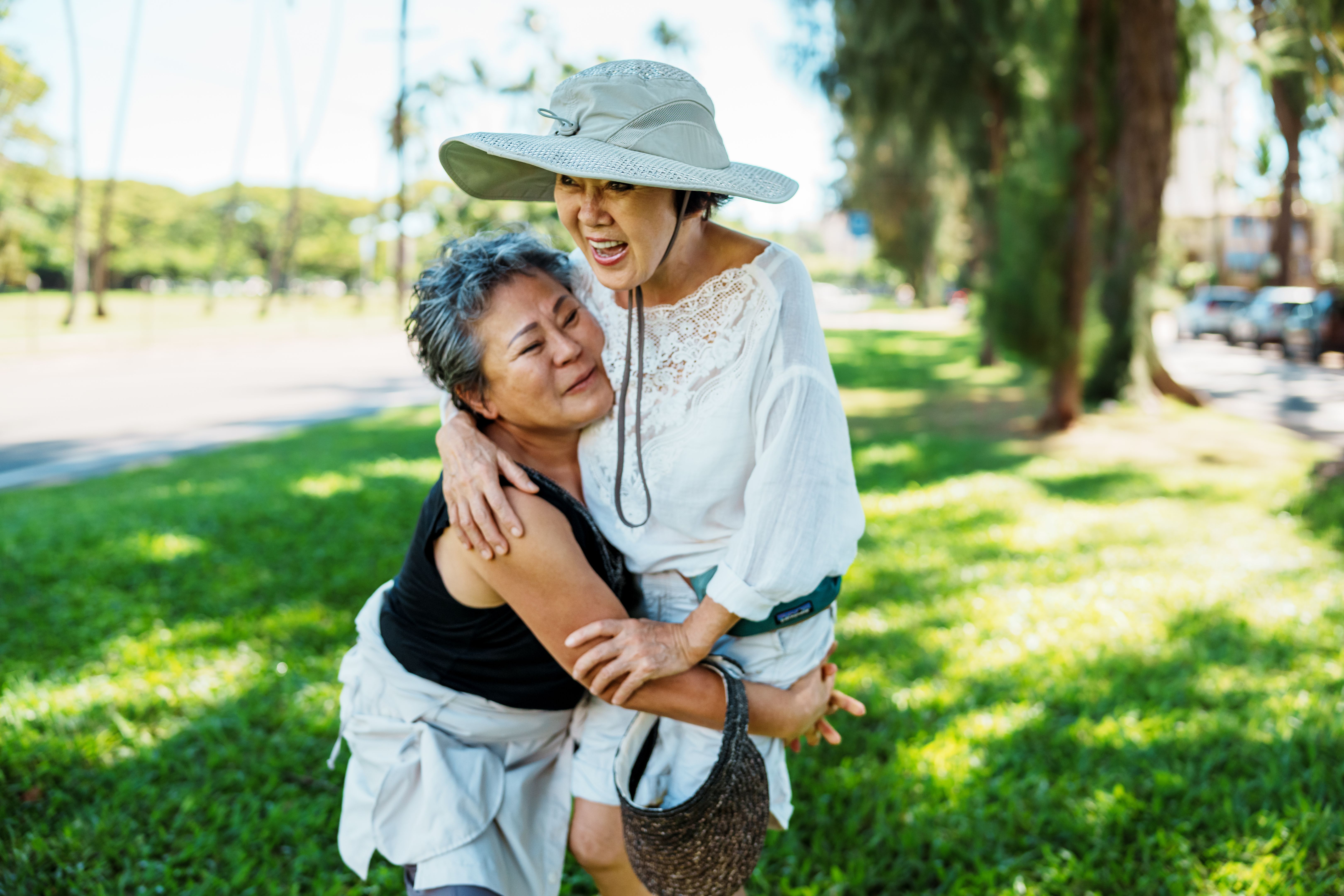 Vibrant senior women having fun together while on a walk