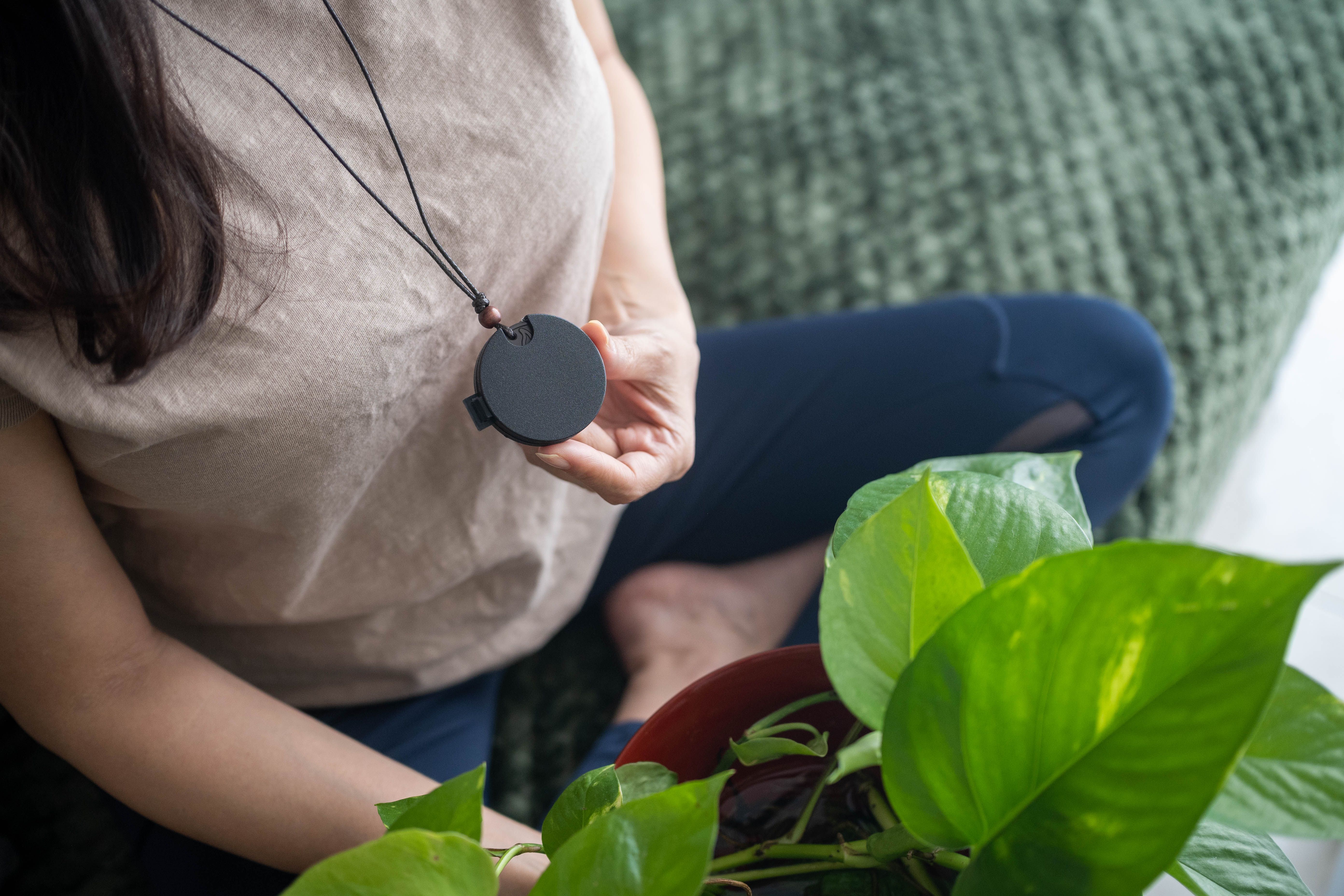 Peaceful Routine: Woman Connecting with Indoor Plants Peaceful Routine: Woman Connecting with Indoor Plants