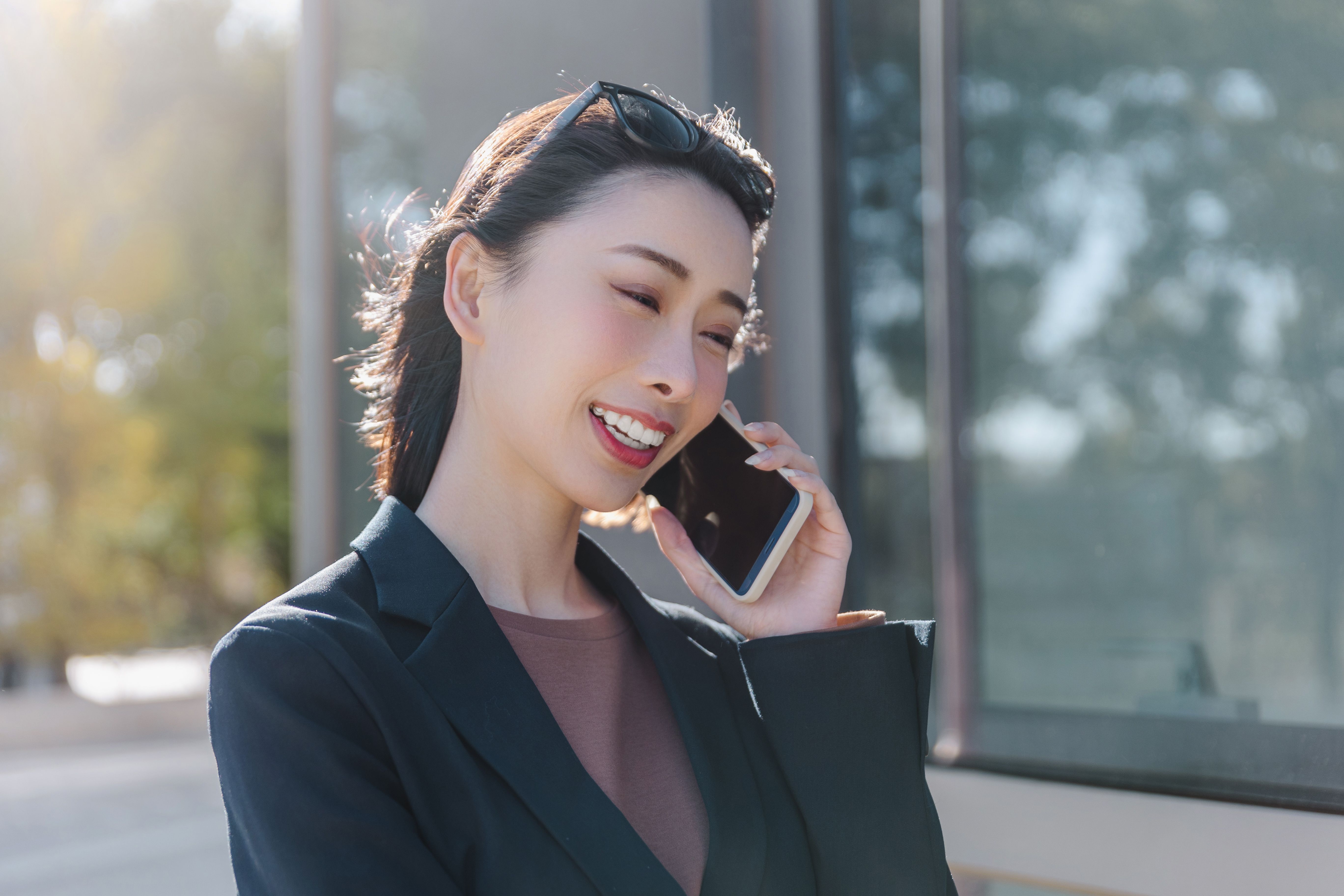 Successful female manager standing on the city street.
