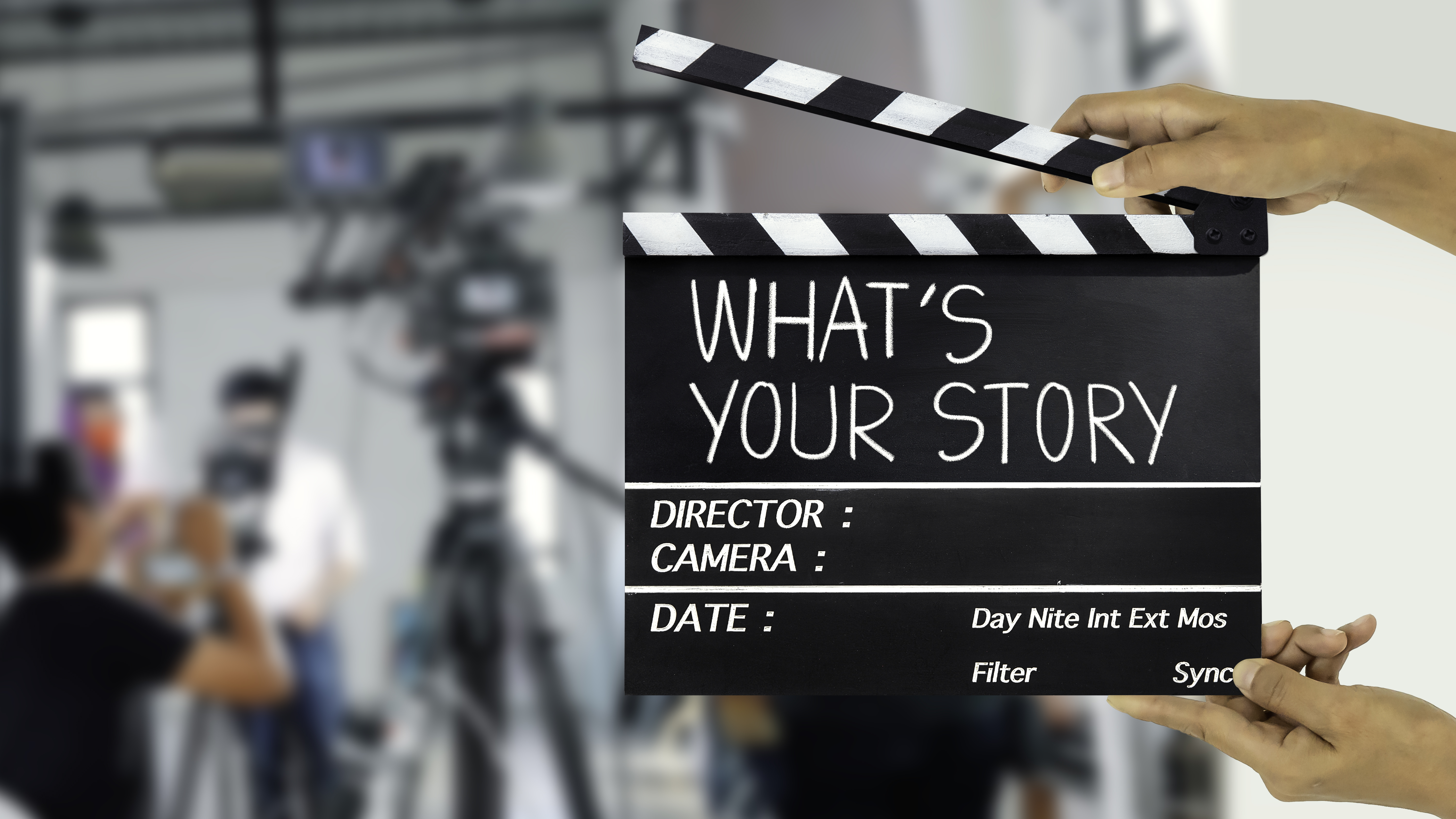What's your story.text title on film slate and film crew in background