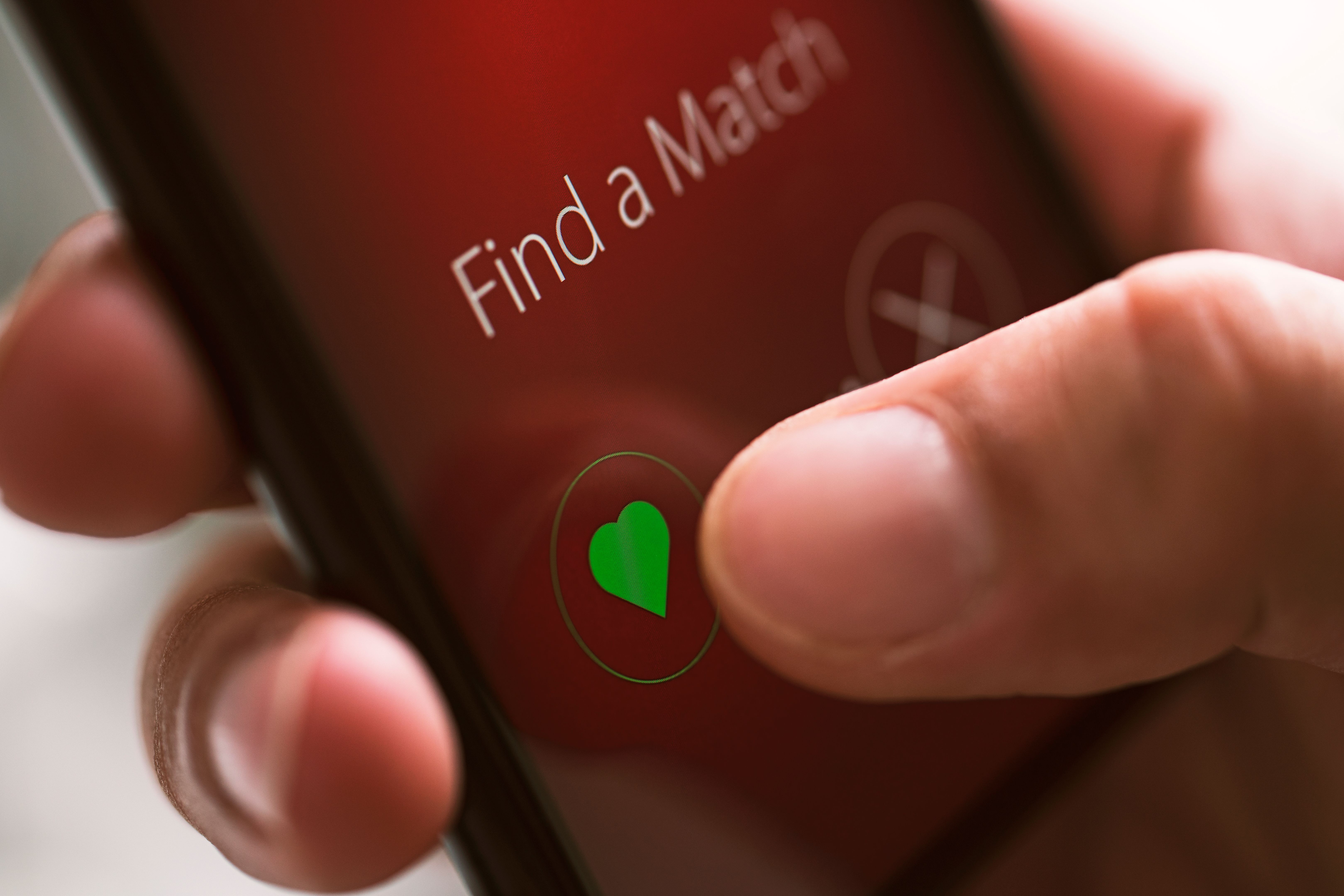 Online dating app on mobile phone screen