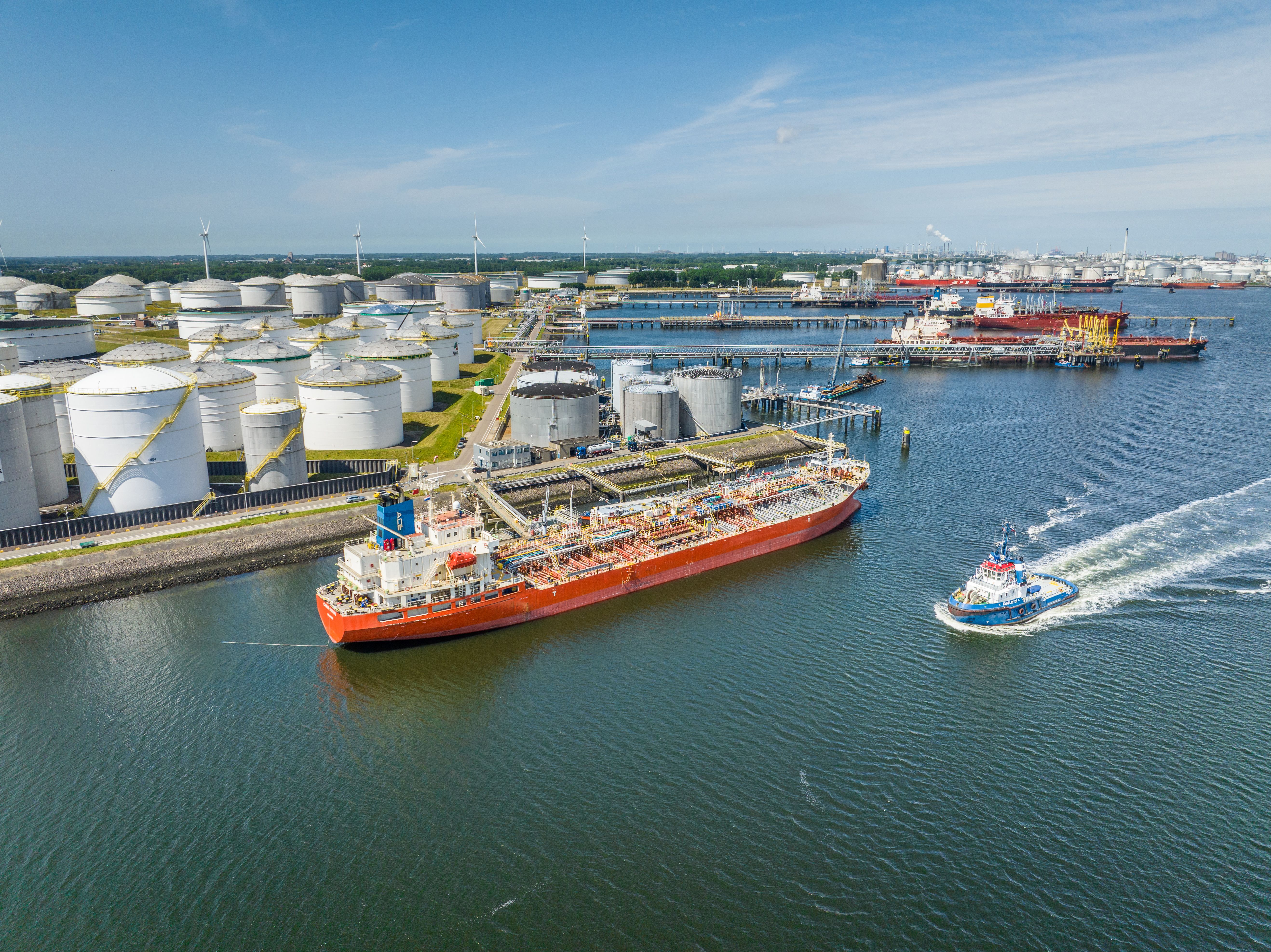 Crude Oil Cargo Transporter Ship Unloading Petrochemicals to a Fuel Depot