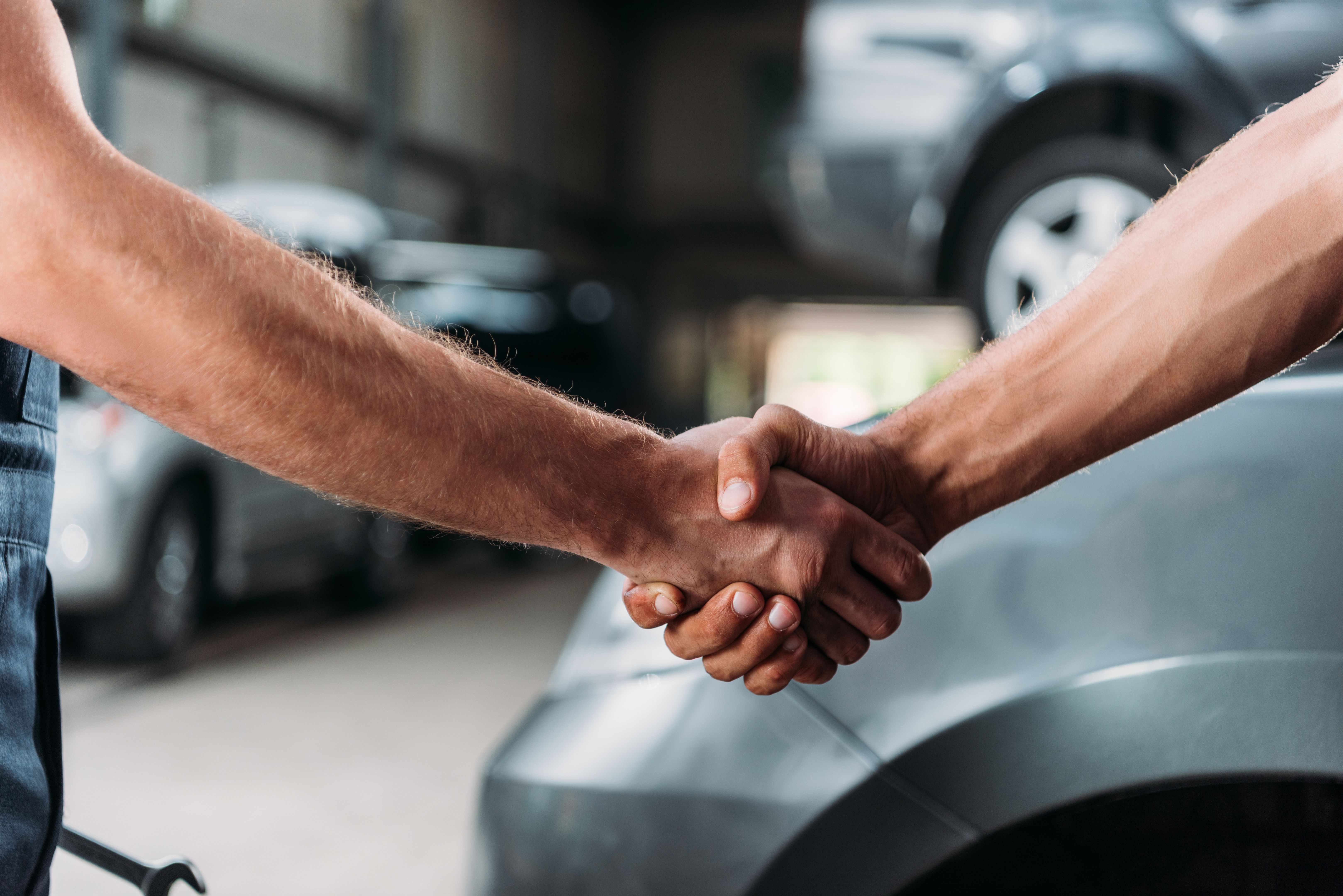 car mechanic handshake