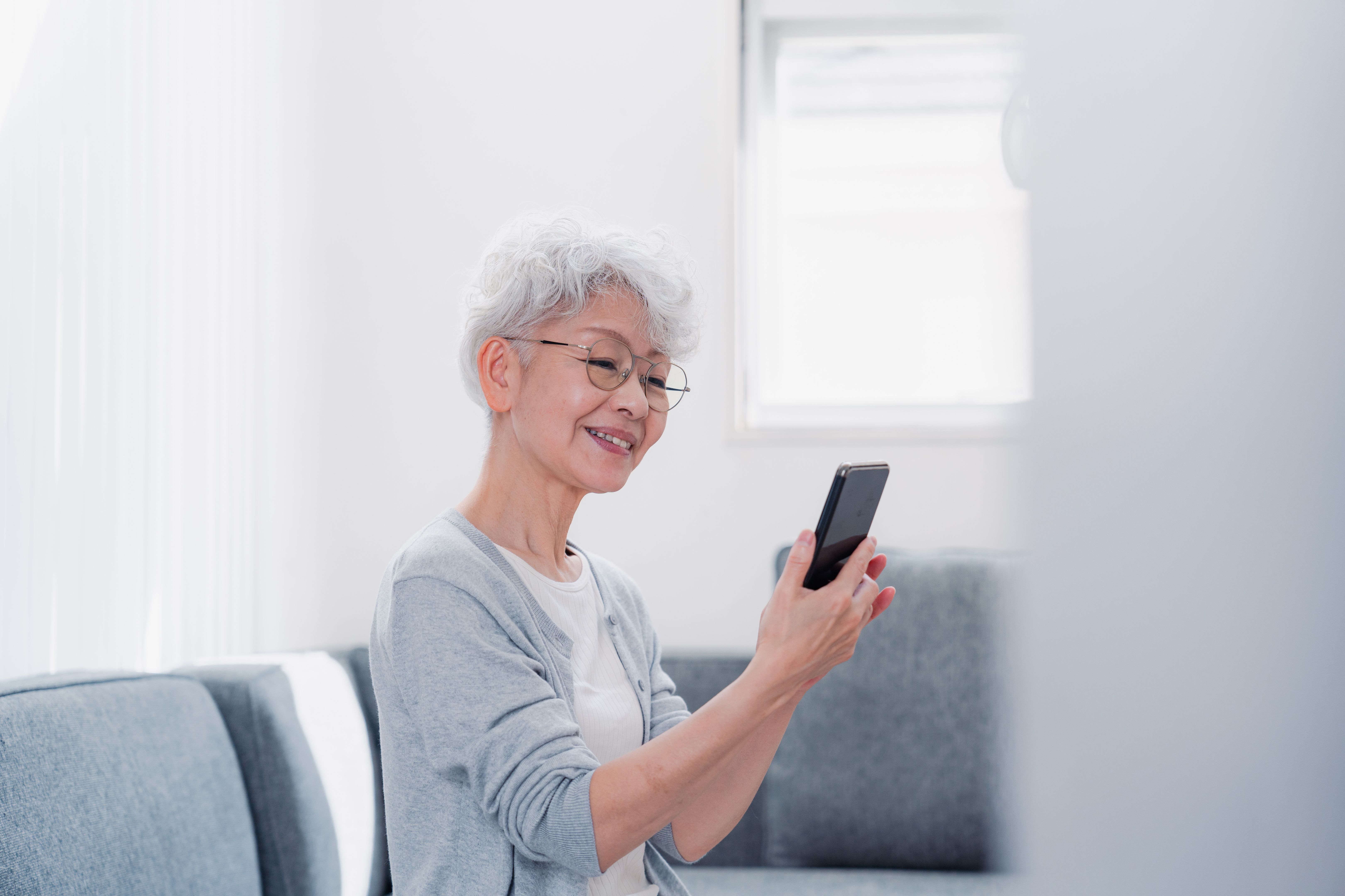 senior using smartphone