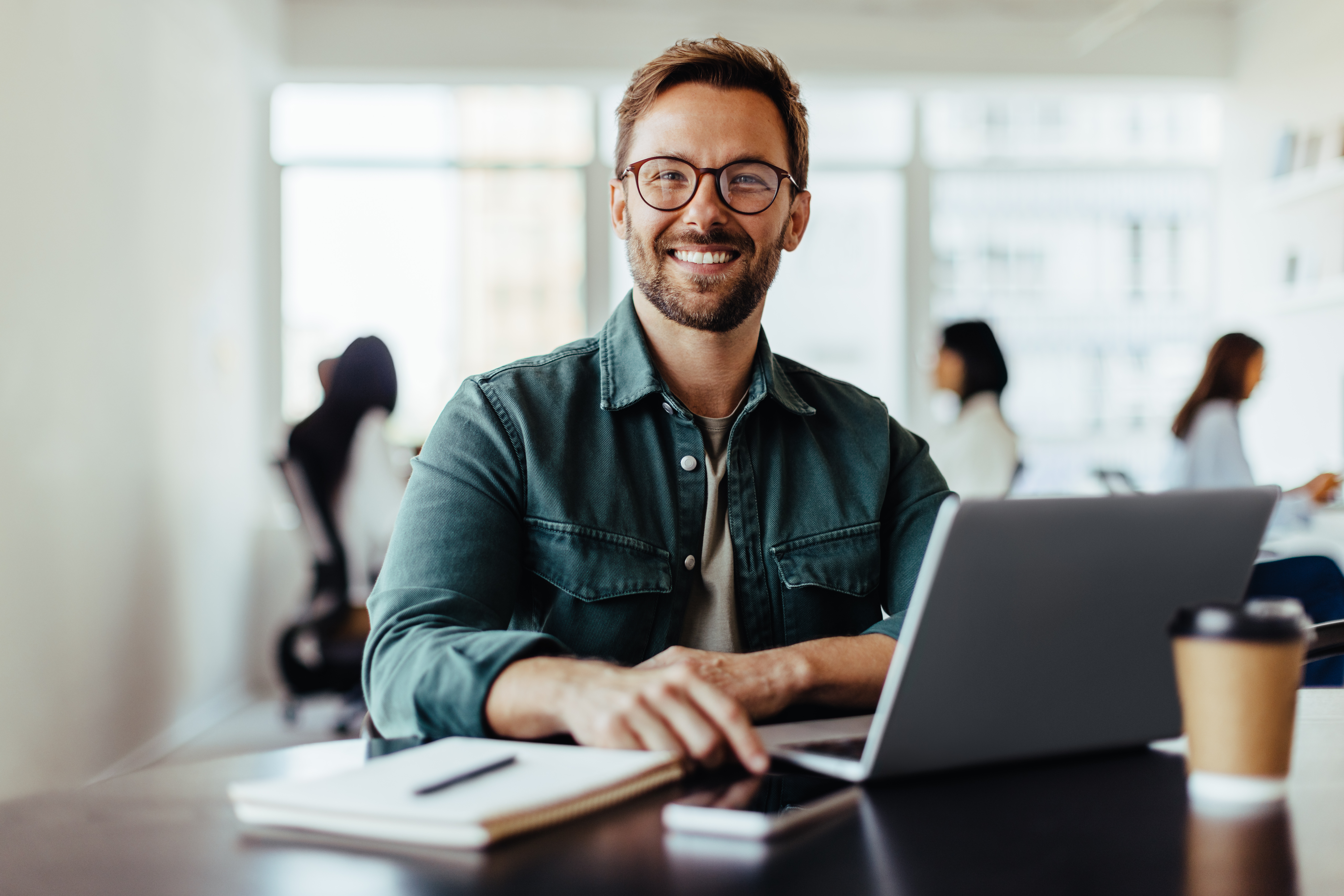 Portrait of a business man sitting in an office Portrait of a business man sitting in an office