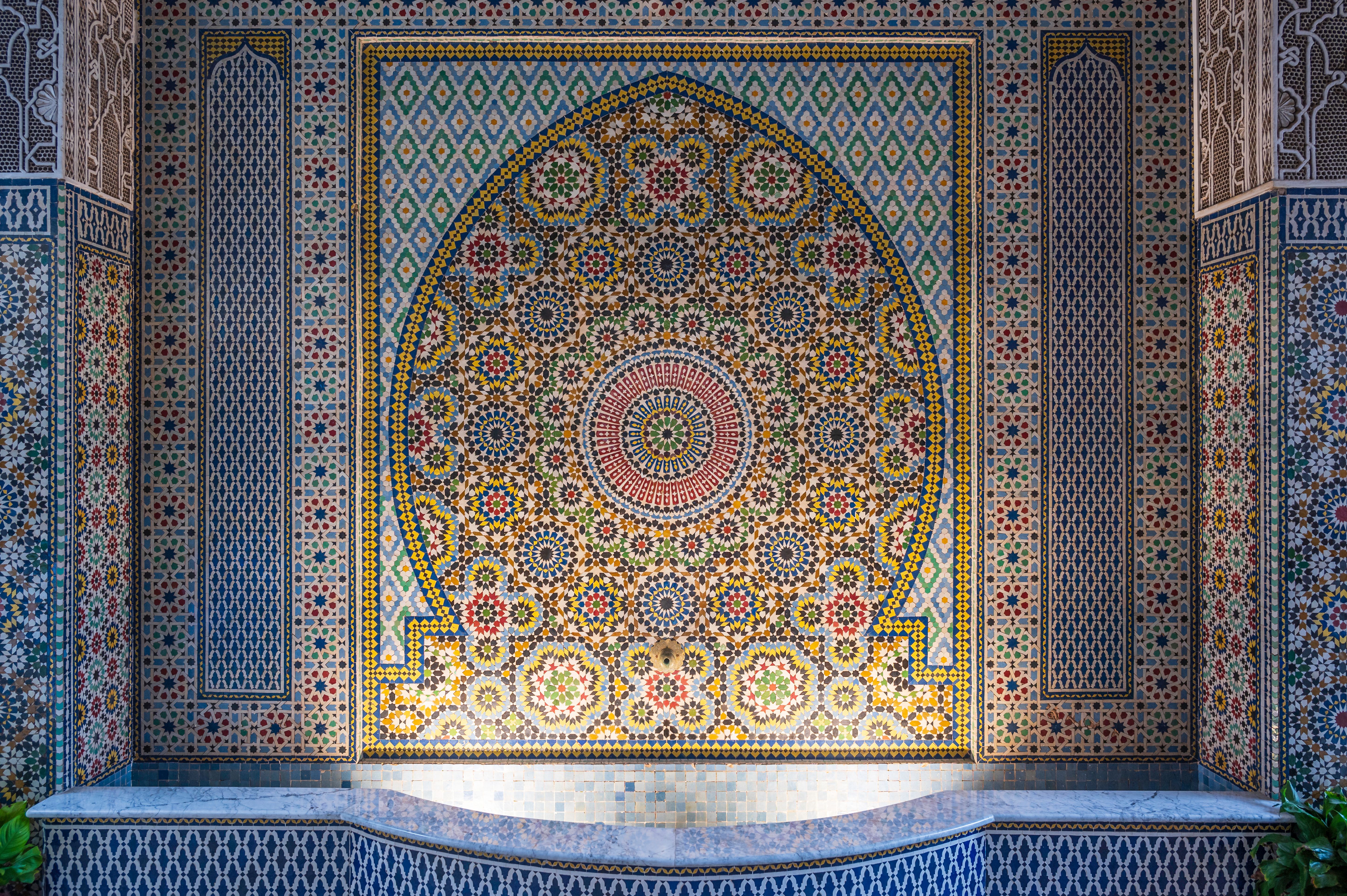 Intricate mosaic decoration in Marrakesh, Morroco. Islamic patterns around an ancient water well.