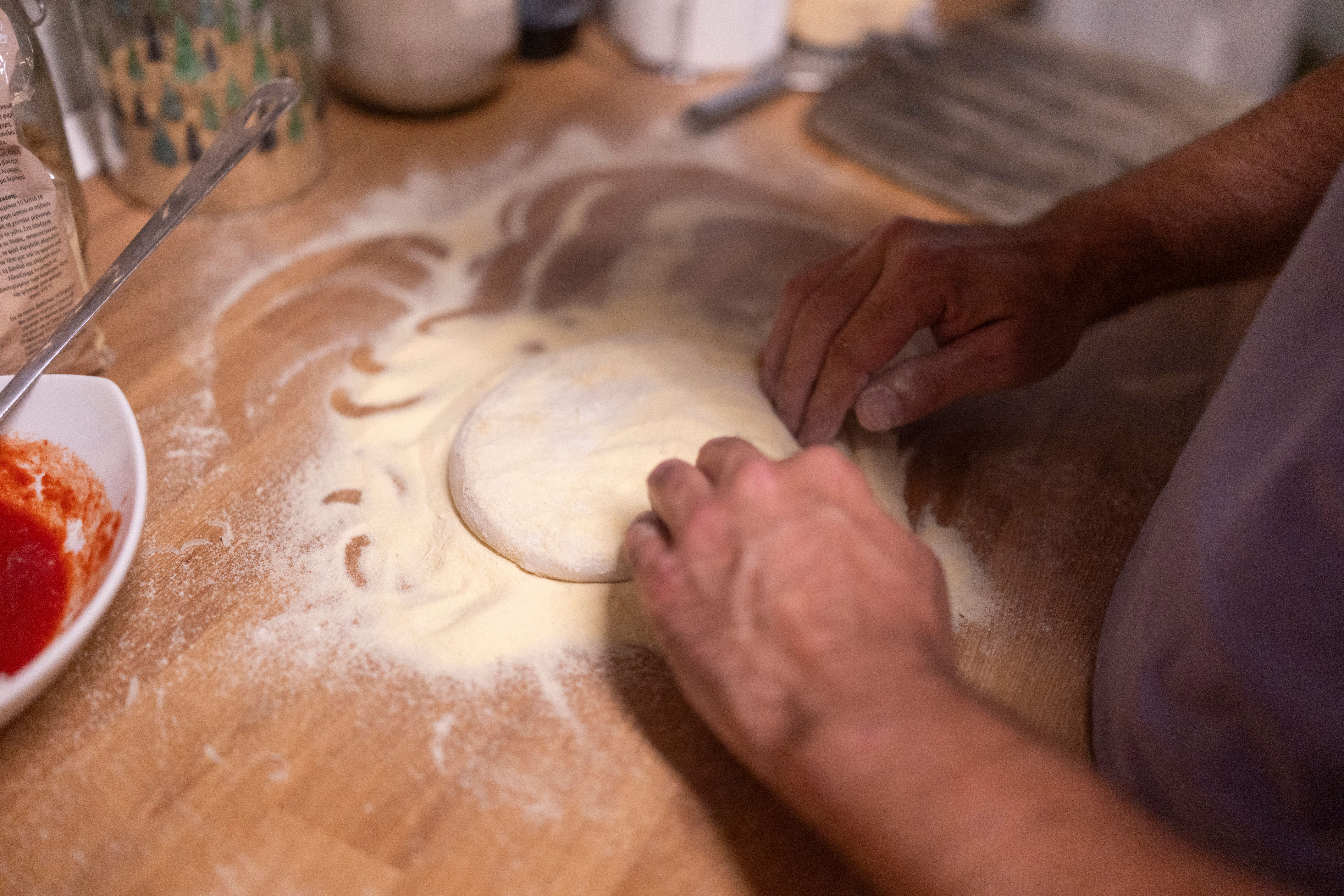 kneading pizza dough