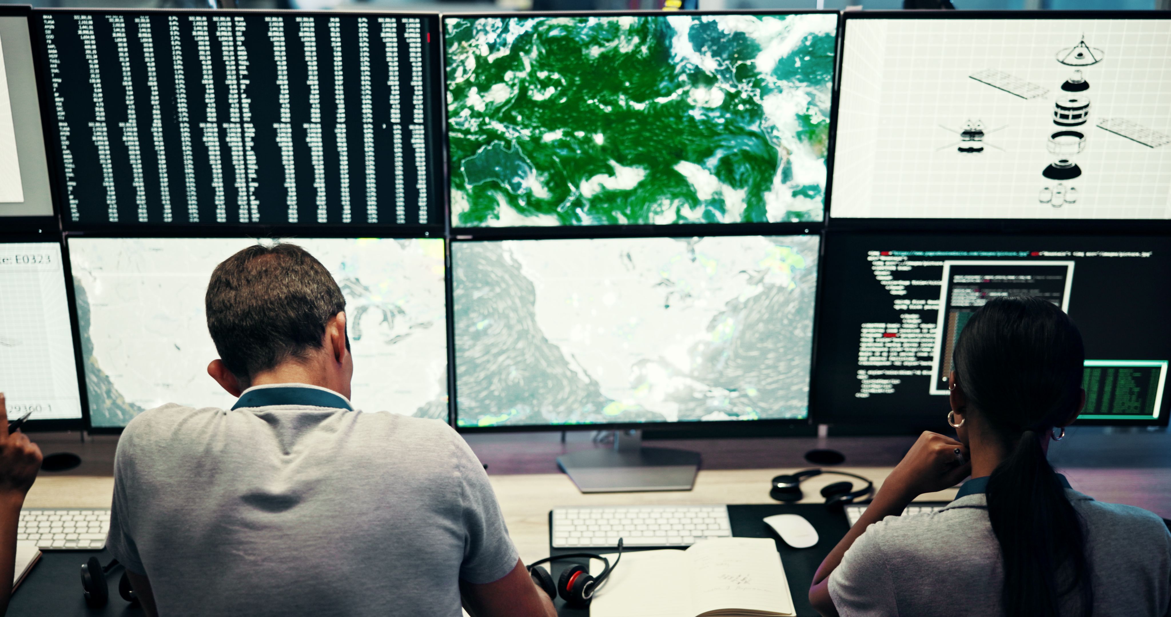 Screen, people and meteorology with monitor for weather, satellite maps and team to track storm. Control room, back and scientists with forecast for broadcast news, pattern review and climate change Screen, people and meteorology with monitor for weather, satellite maps and team to track storm. Control room, back and scientists with forecast for broadcast news, pattern review and climate change