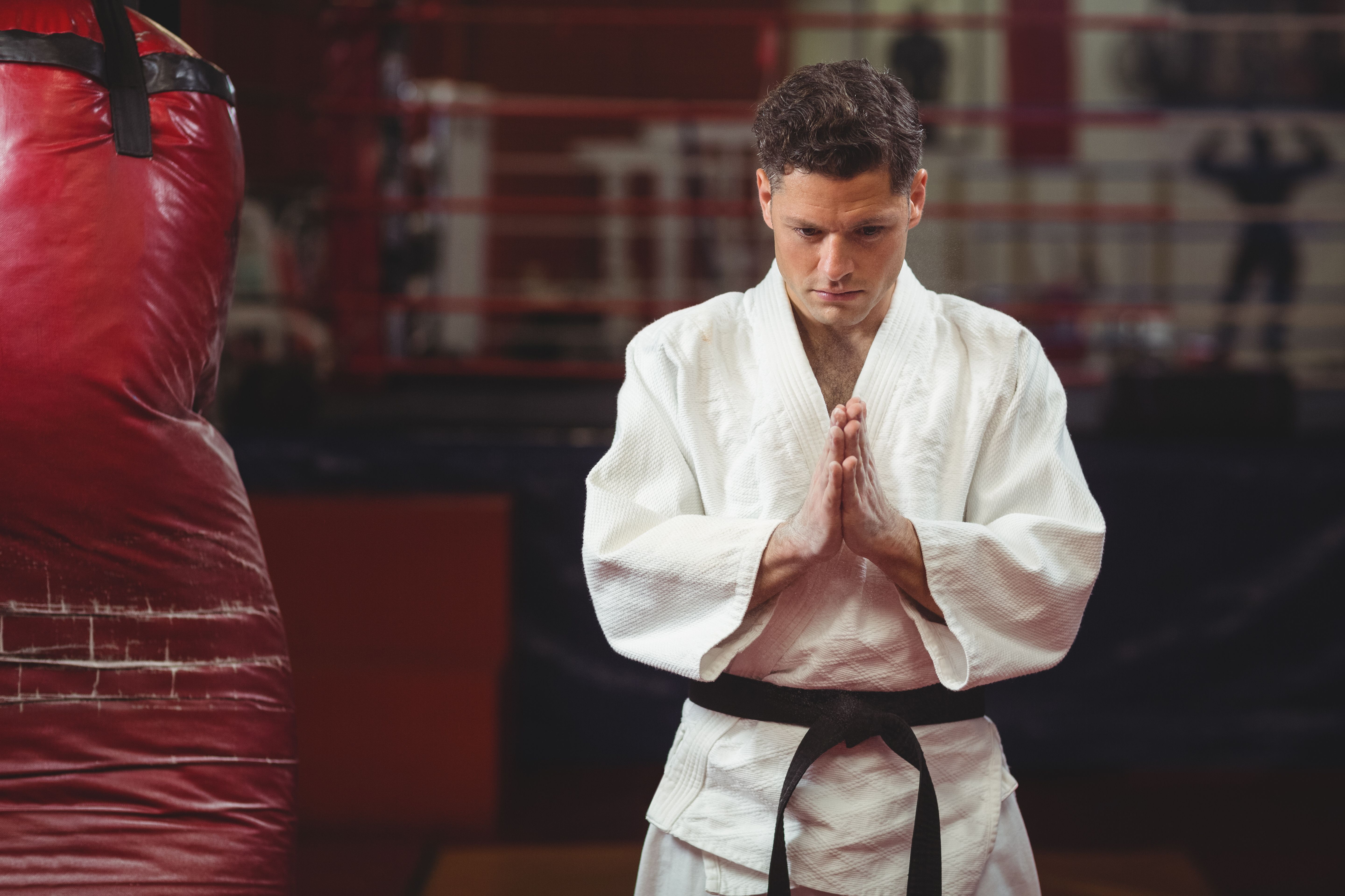 Karate player in prayer pose Karate player in prayer pose