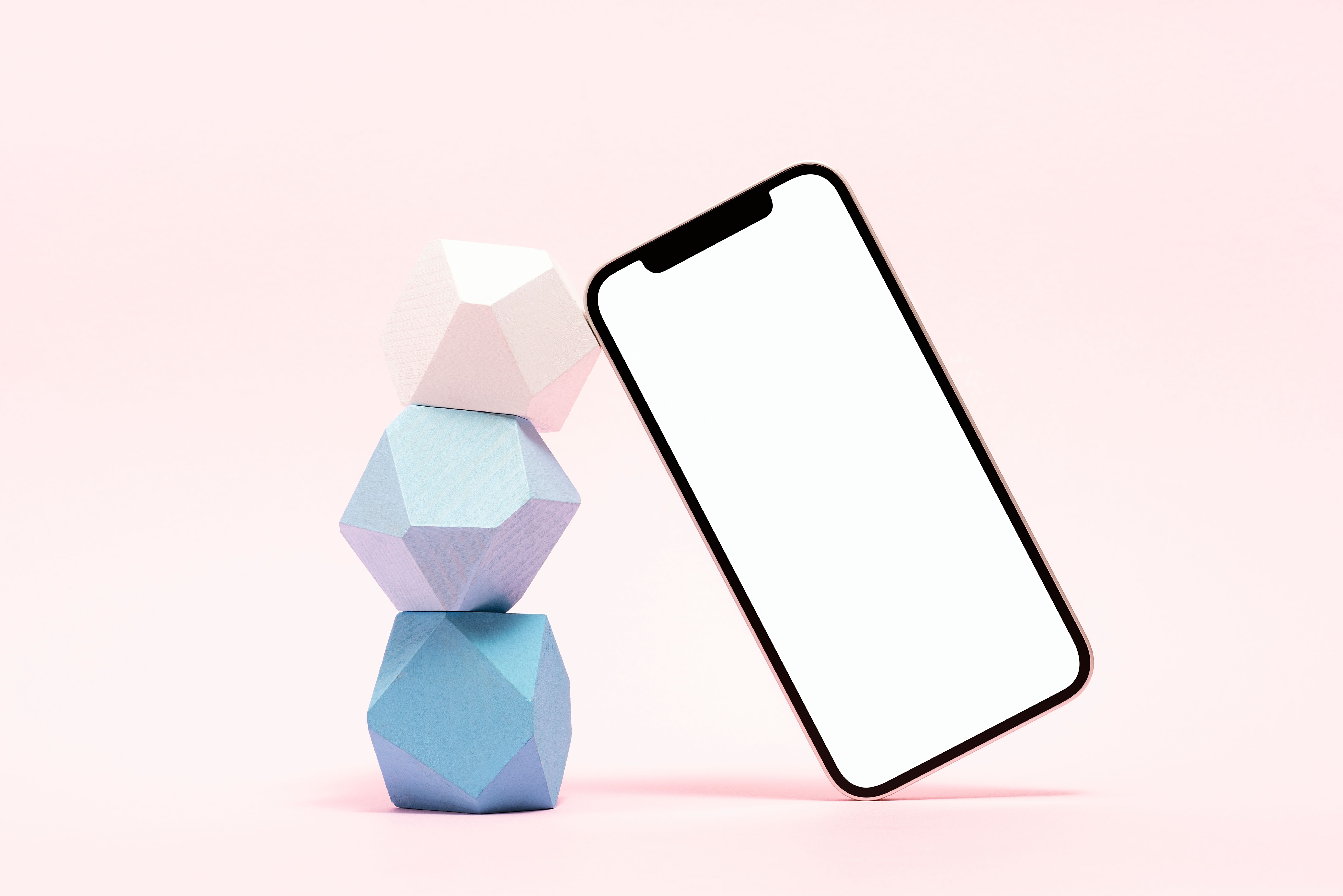 Blank screen smart phone mockup, template with wooden balancing toys