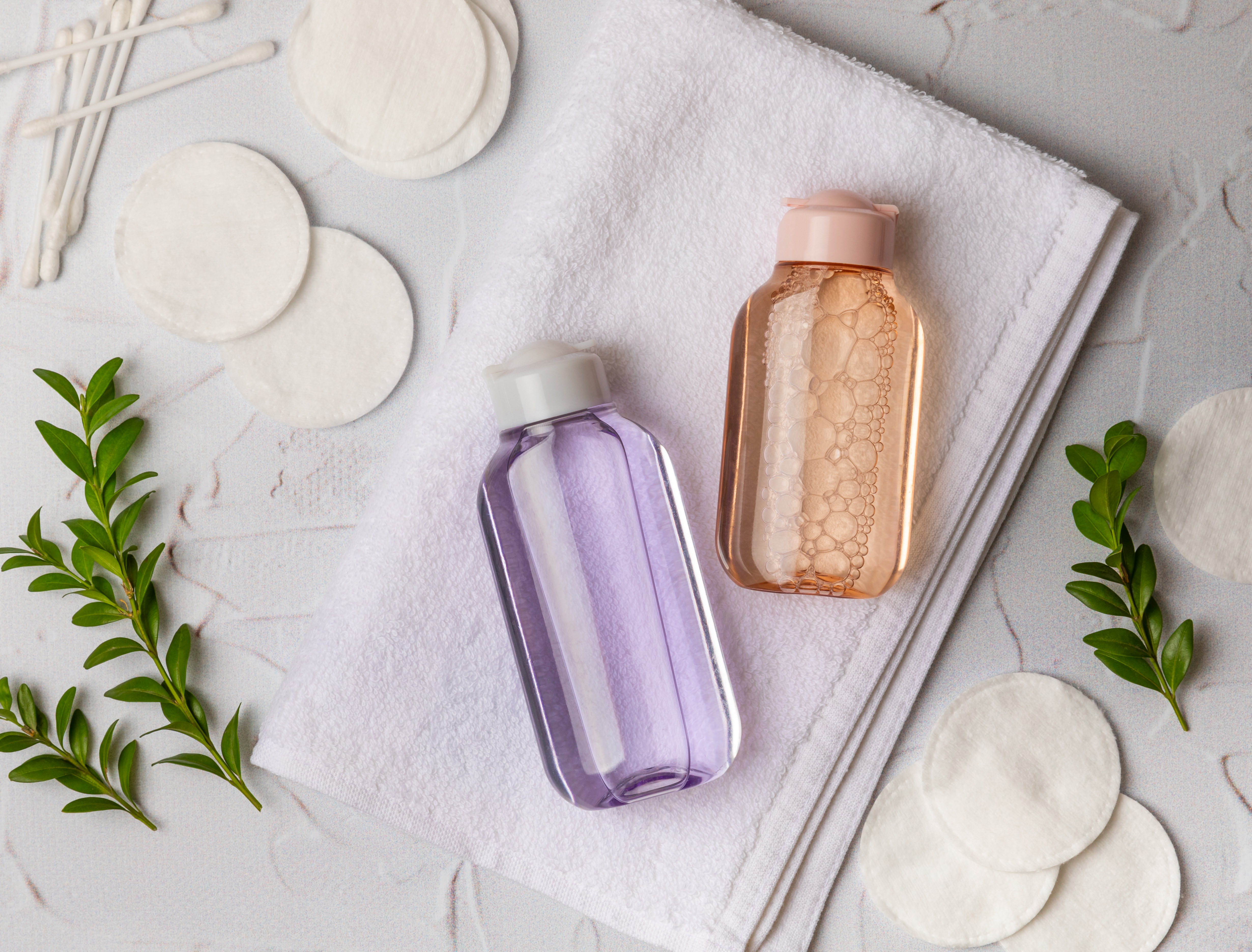 Micellar cleansing water and pads for removing makeup and cleansing the skin of sebium. Tonic, serum or lotion. Skin care. Beauty concept.FLETLEY.Top view. Place for text. copy space