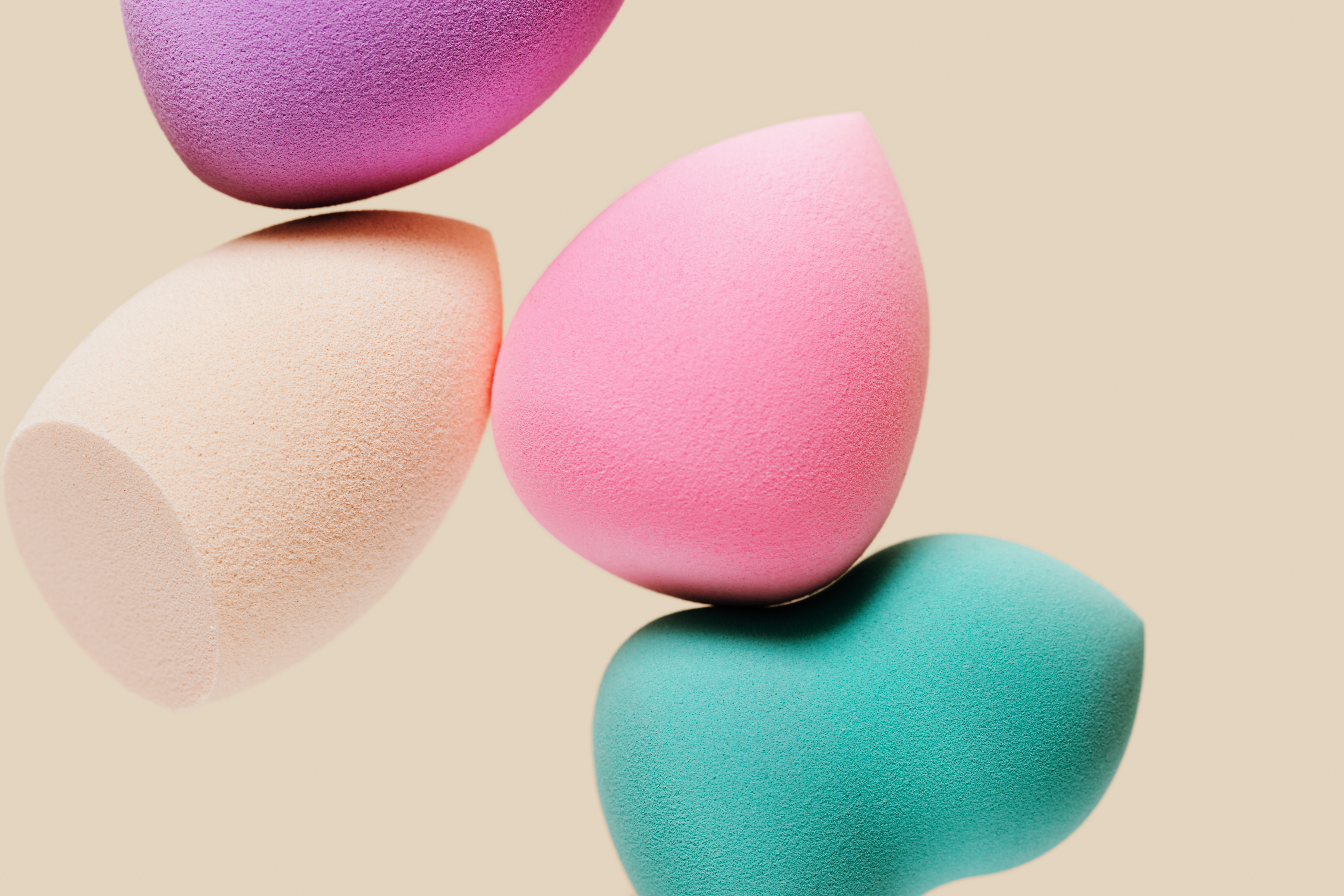 Colored cosmetic beauty blender sponges Green, violet, pink, rainbow colored sponges different shape. Colored cosmetic beauty blender sponges Green, violet, pink, rainbow colored sponges different shape.