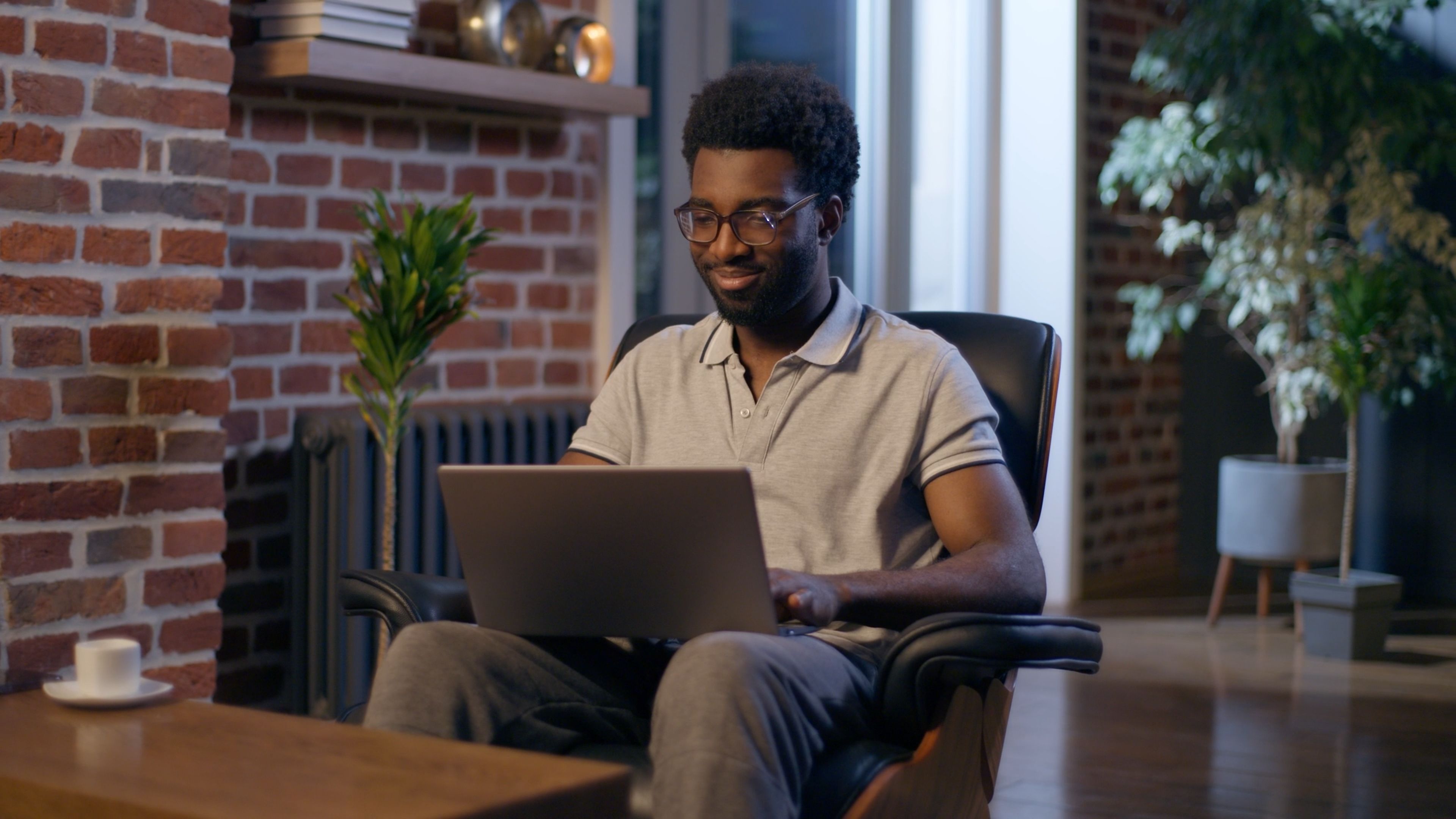 African American man businessman business employer typing laptop in night office overtime online studying deadline task in evening smiling guy male CEO manager programmer computer working web search