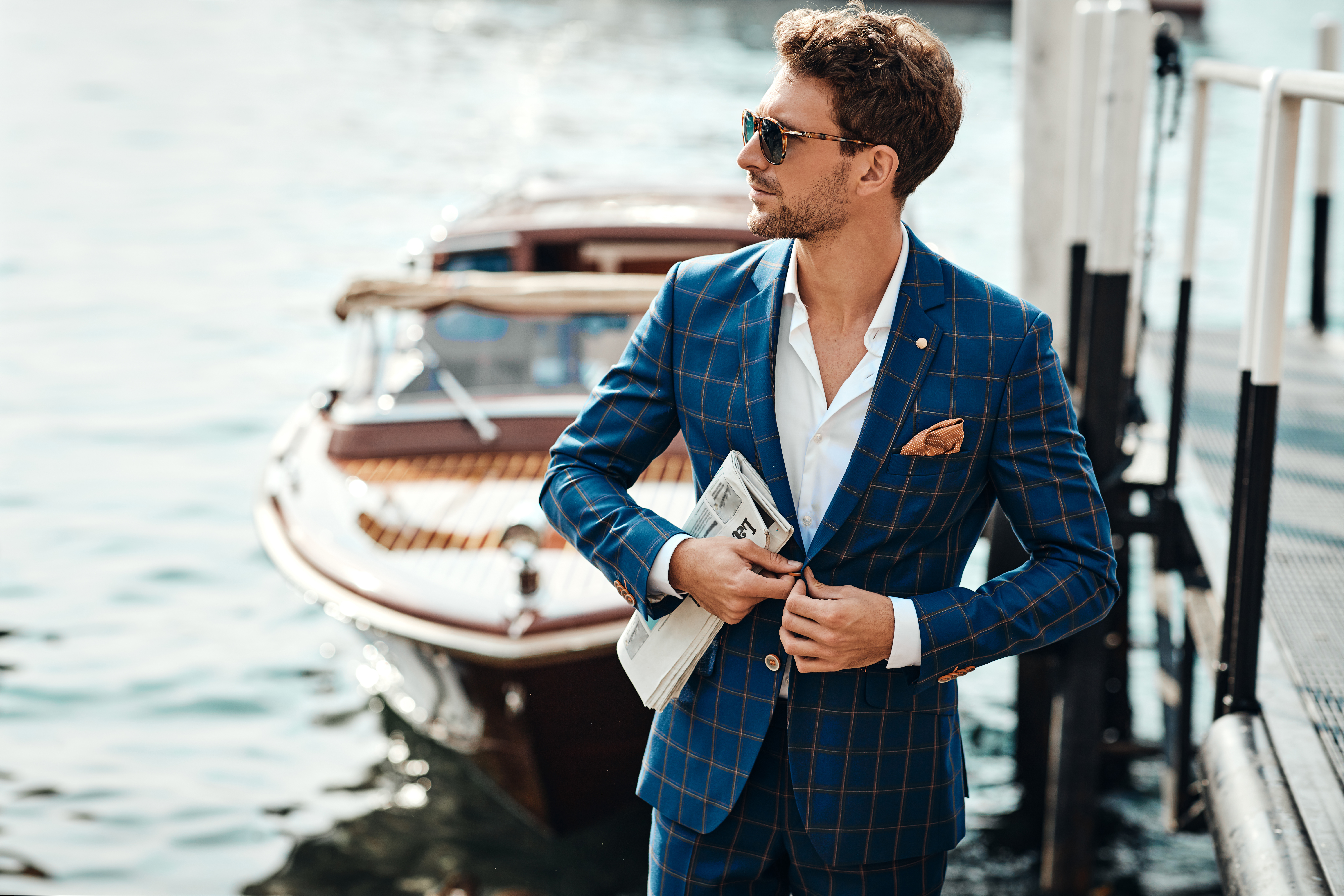 Young handsome man in classic suit over the lake background Young handsome man in classic suit over the lake background