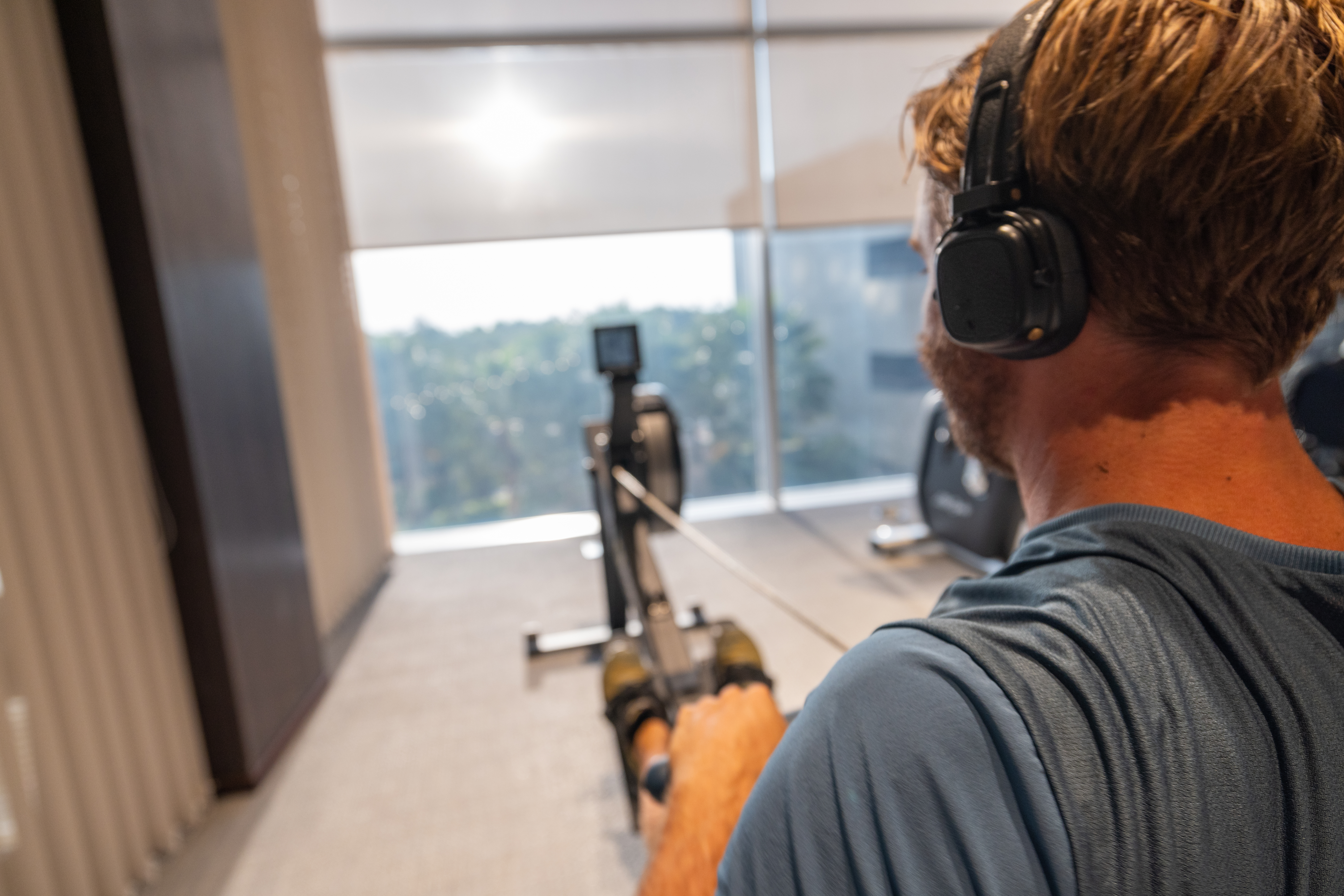 Focus and Fortitude on a Rowing Machine in a Modern Gym