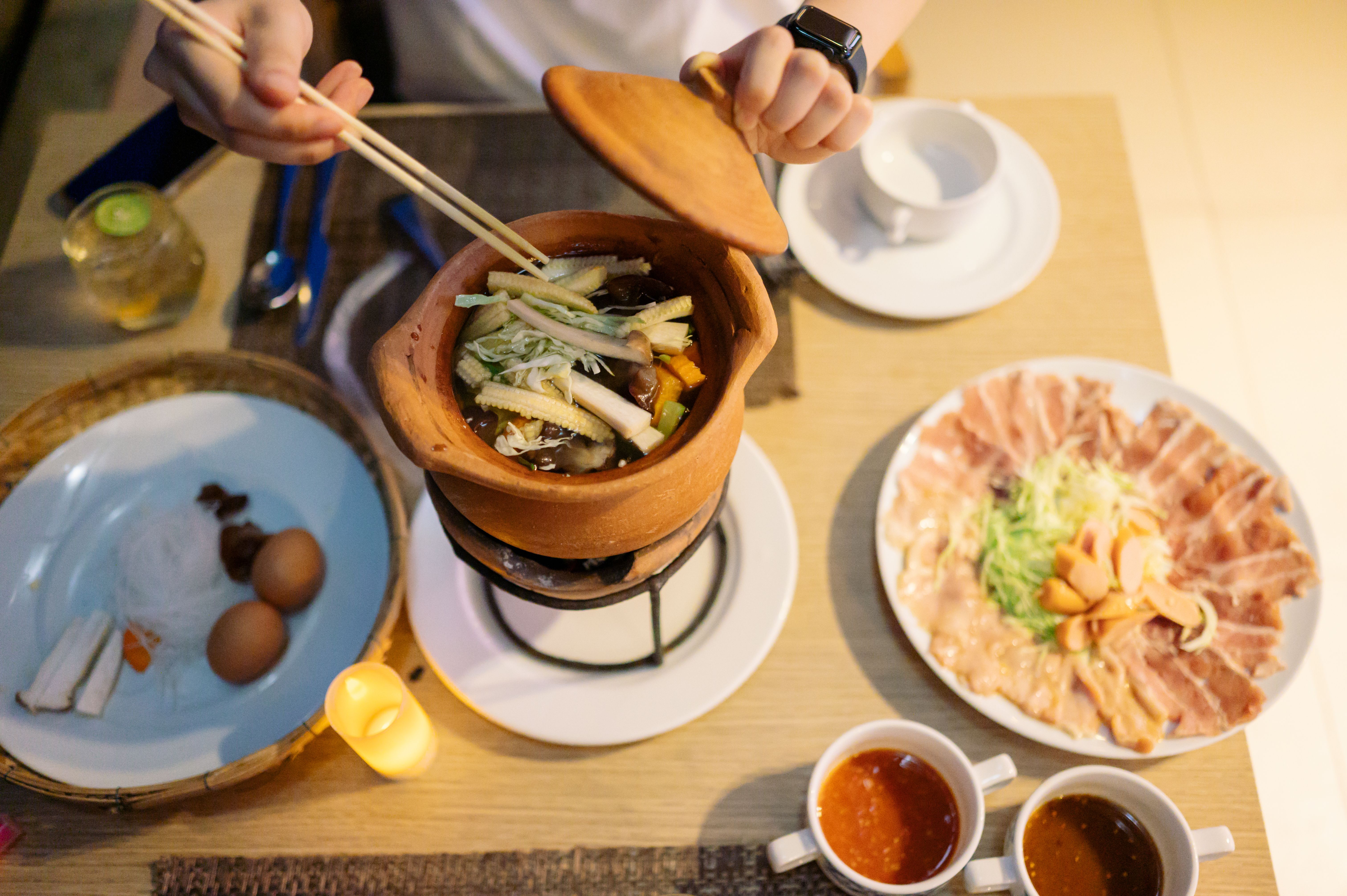 POV Modern GEN-Z friend sharing hotpot meal in chim chum hotpot thai restaurant