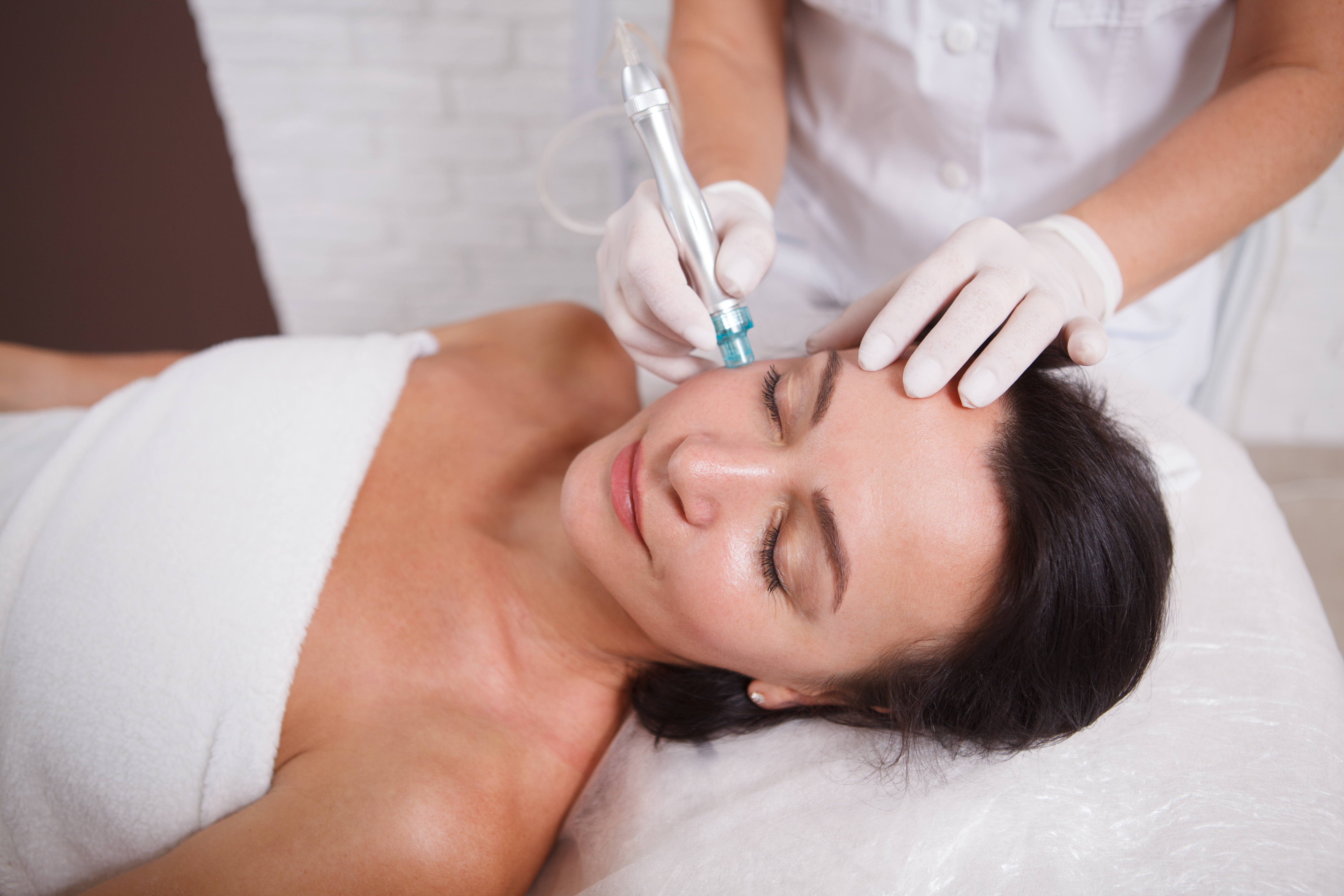 Mature woman getting skincare treatment at beauty clinic