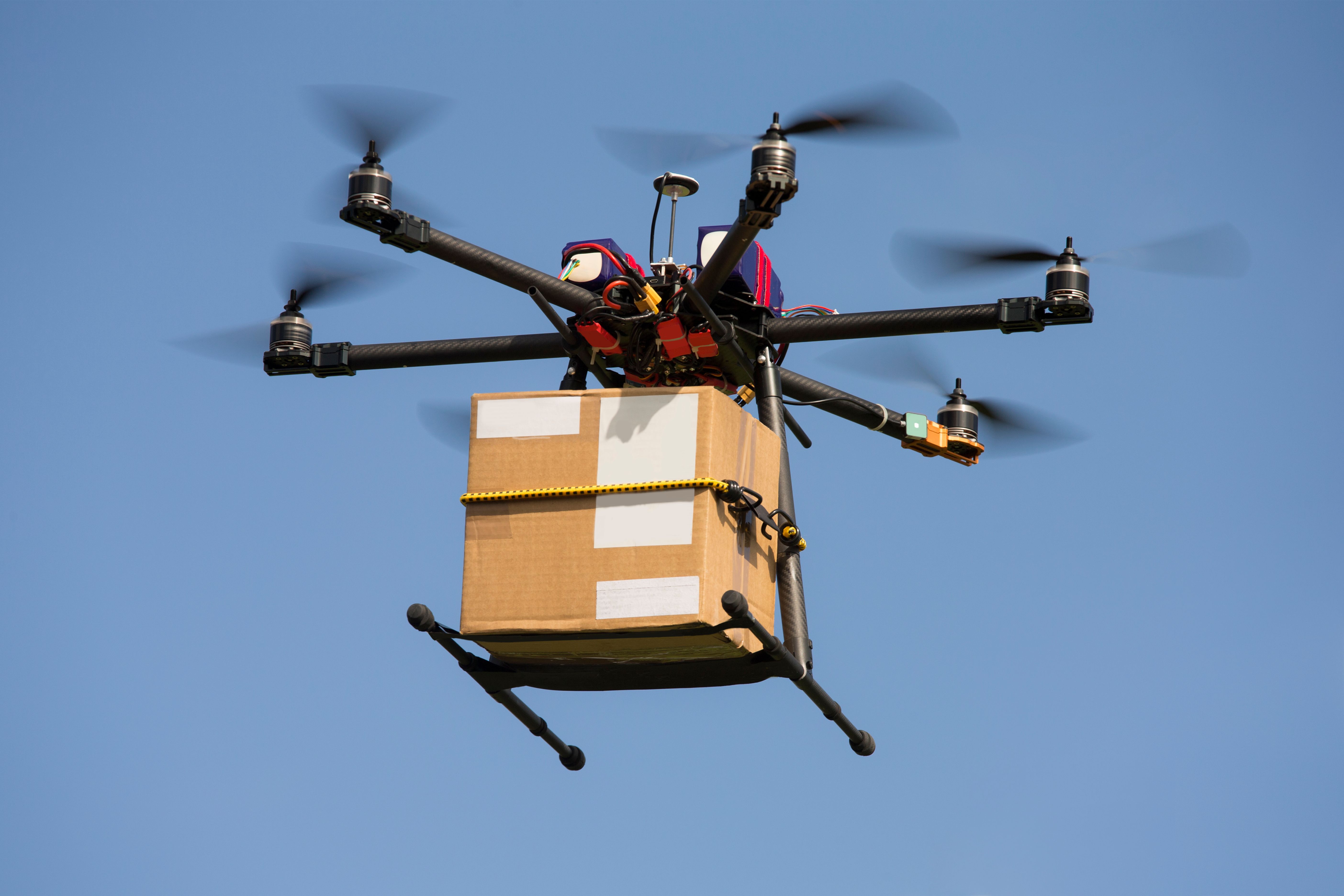 Drone carrying parcel Drone carrying parcel