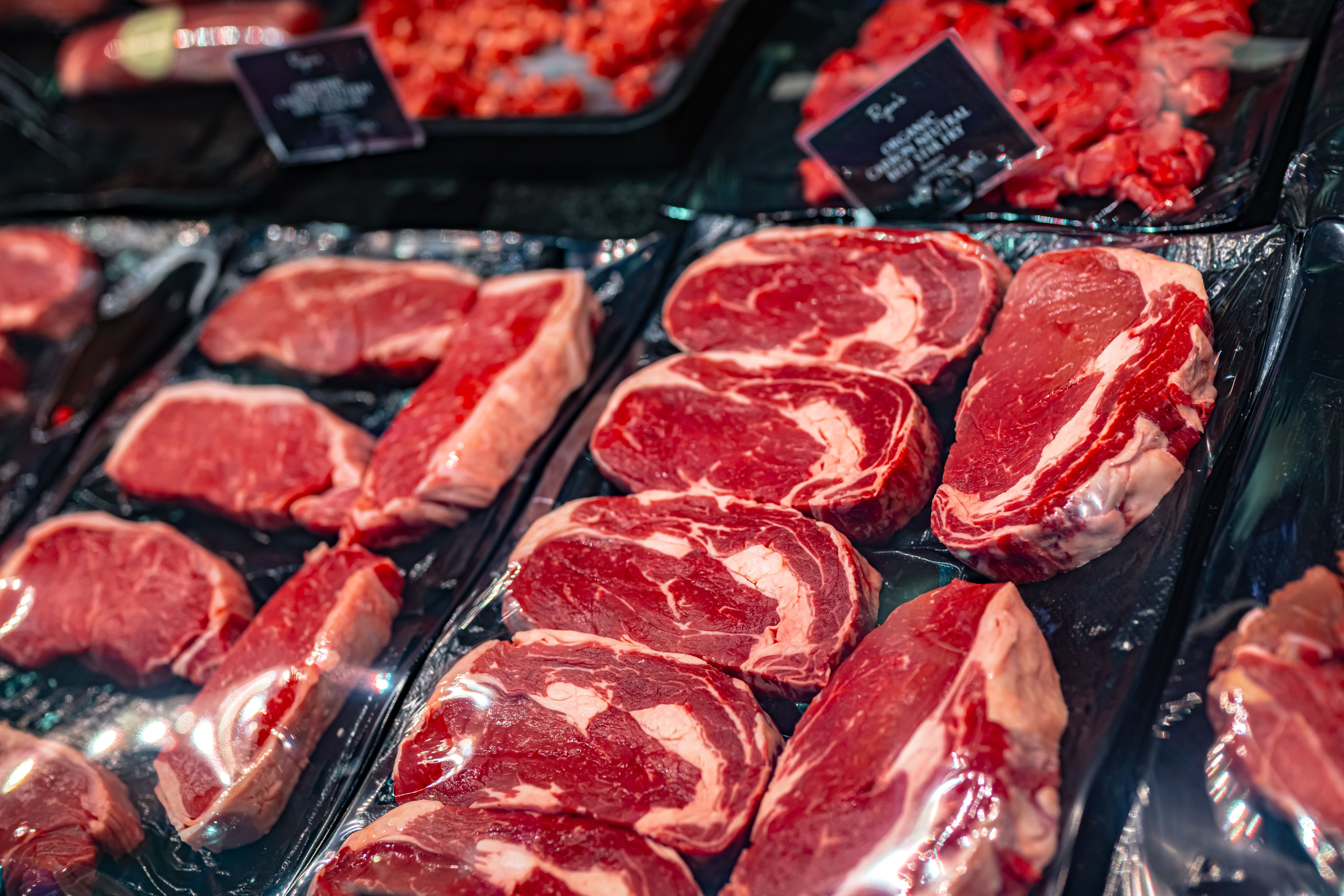 Meat products put up for sale in a commercial refrigerator