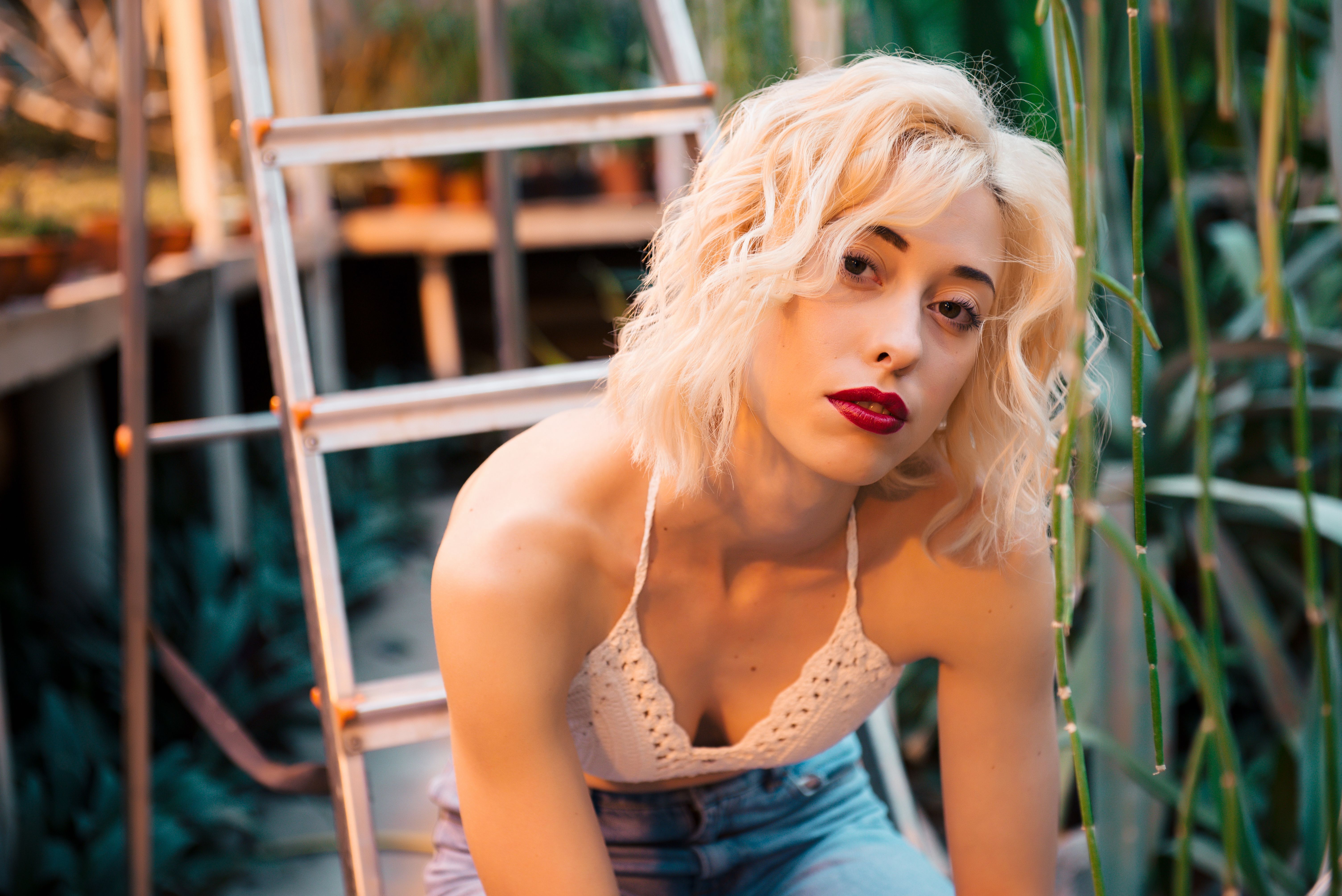 Portrait of sensual young female model at botanical garden