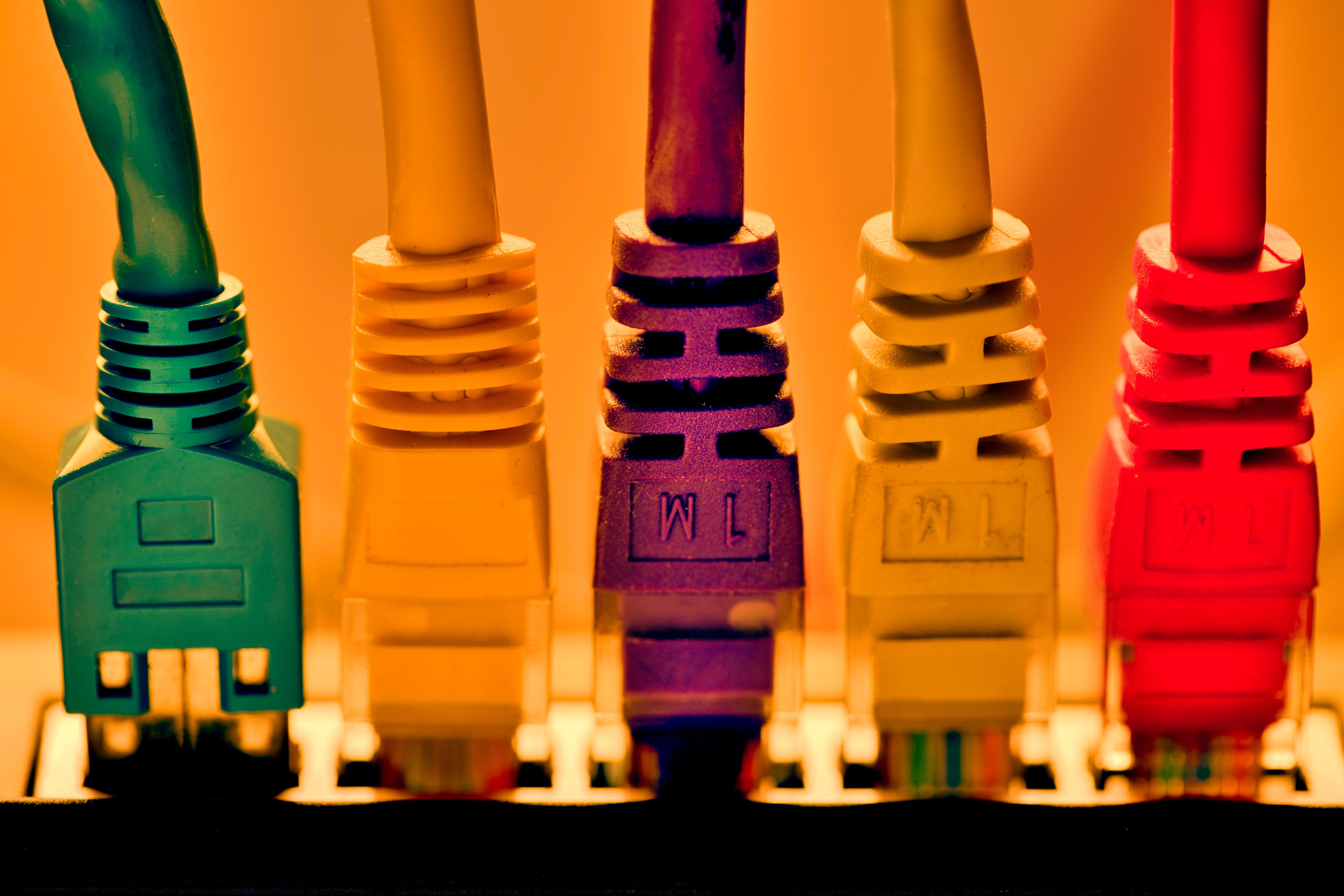 Home switch or WLAN router with plugged-in RJ45 plugs