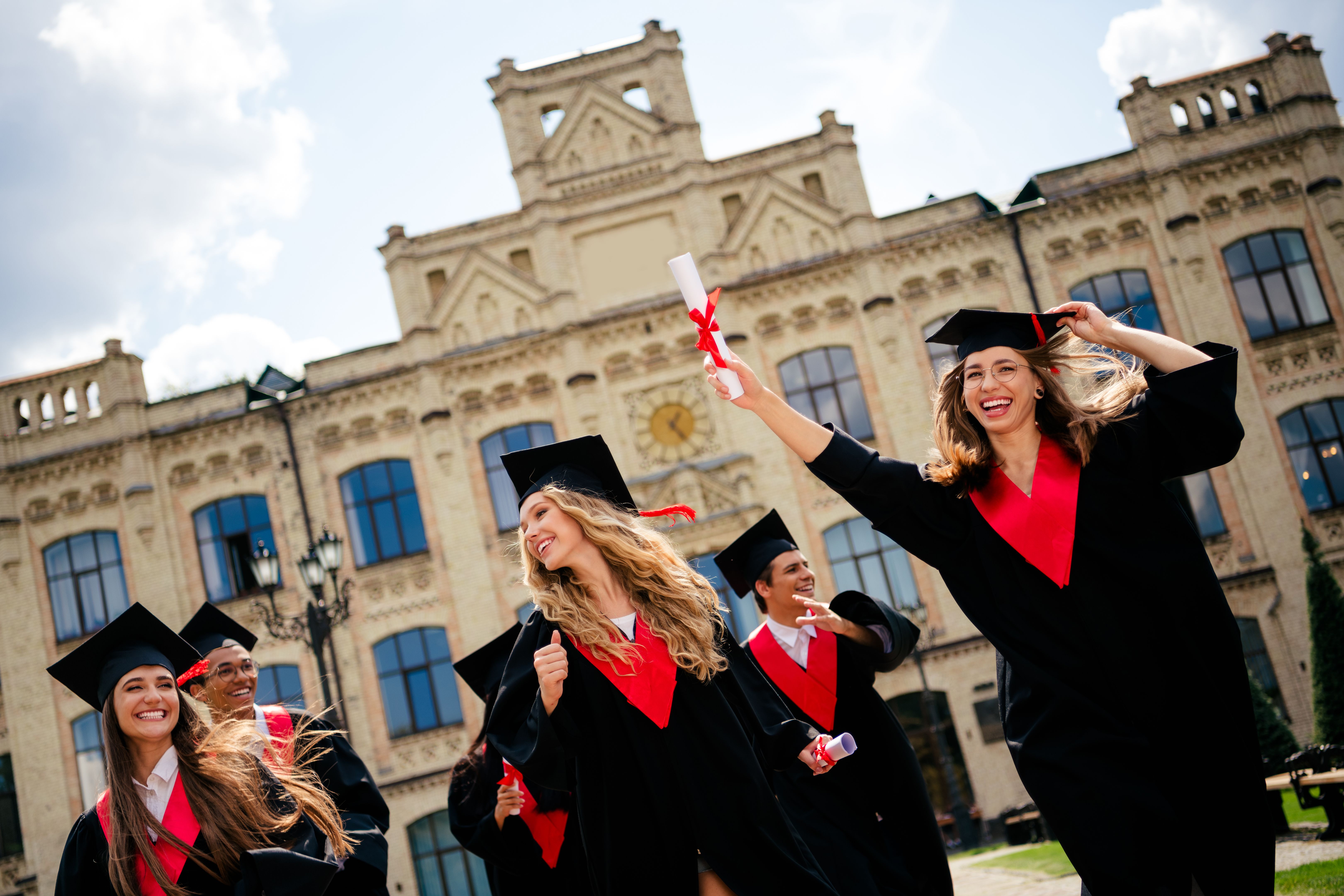 students celebrating graduation