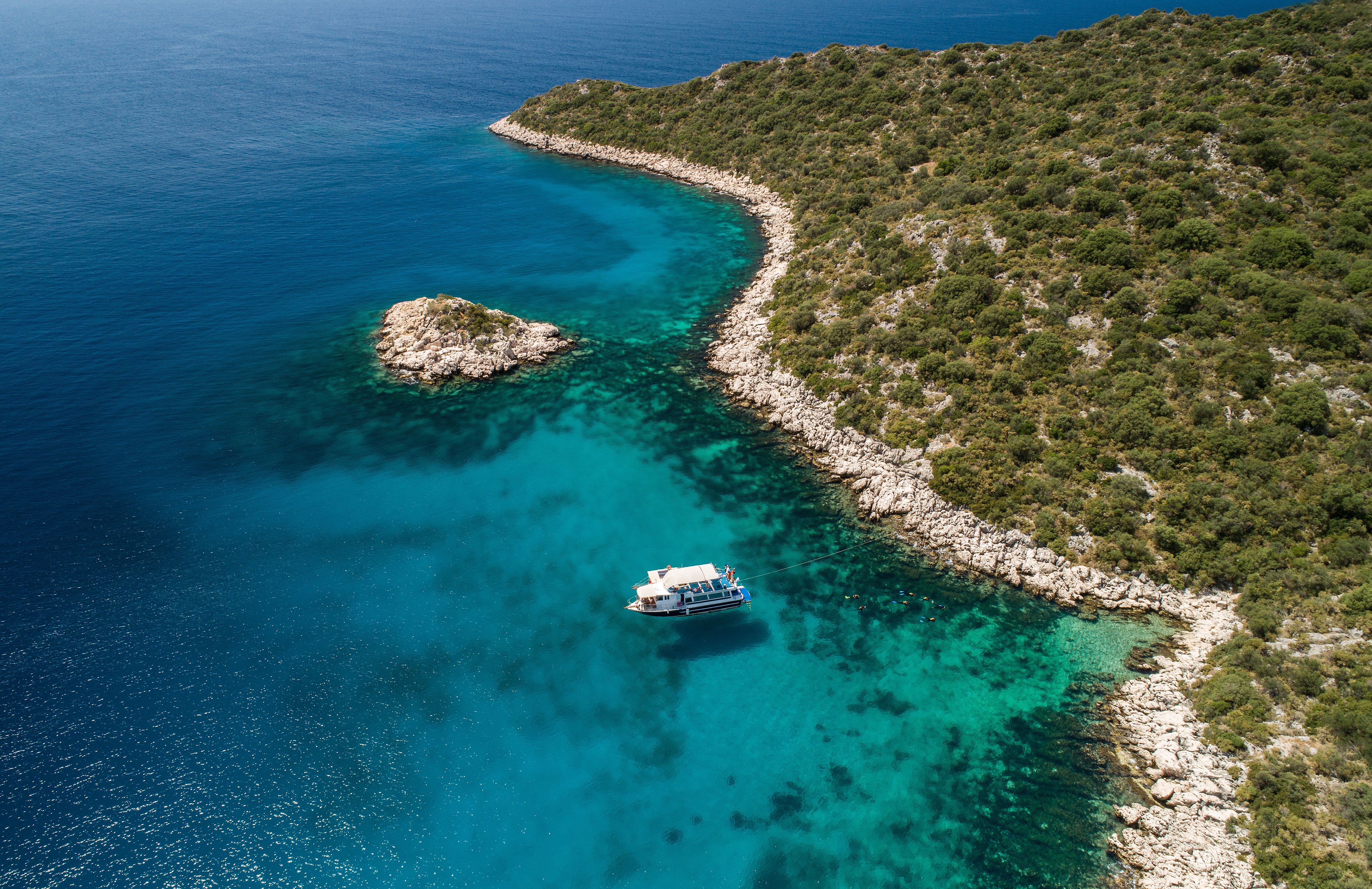 Aerial view of clear turquoise sea and yacht Aerial view of clear turquoise sea and yacht