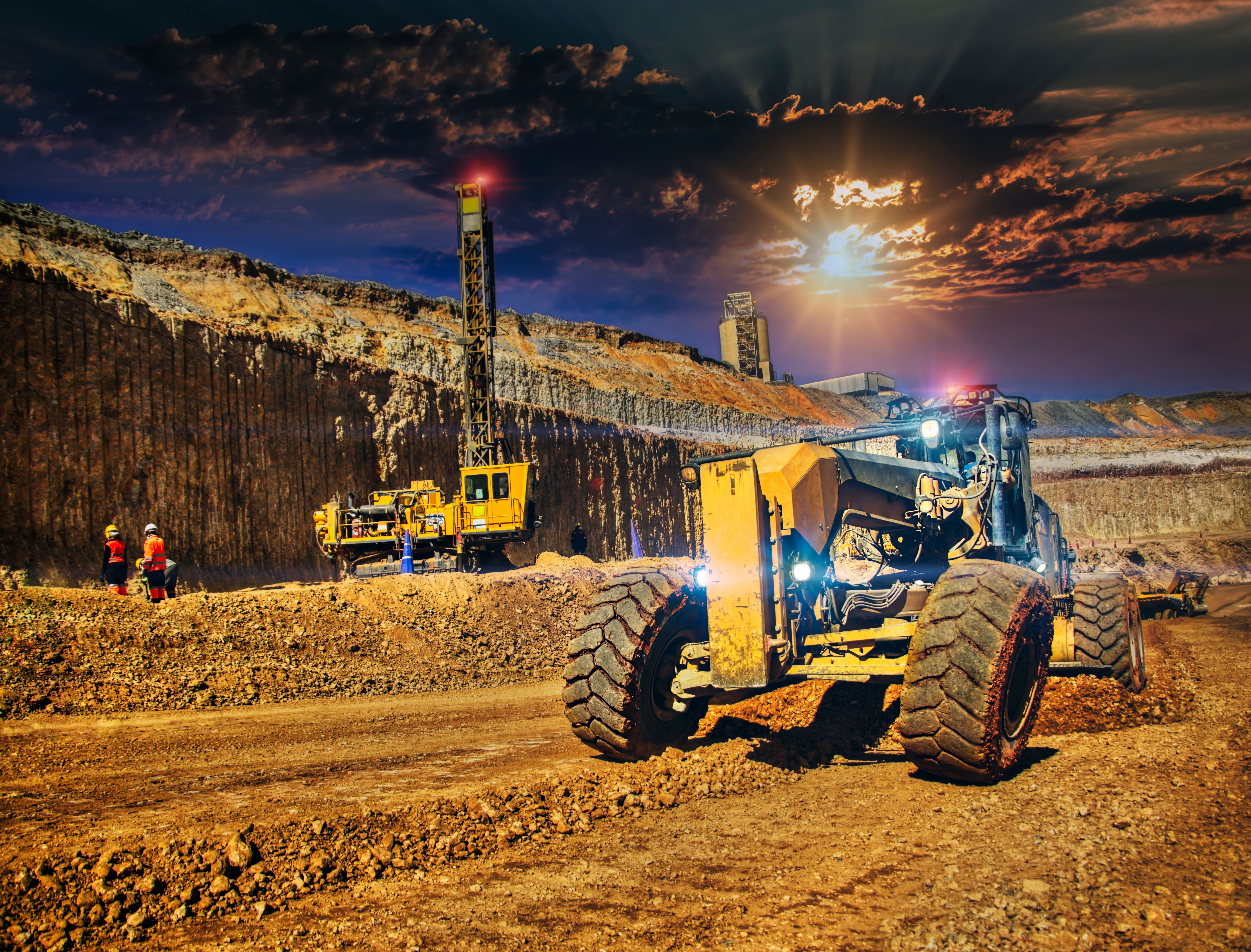 grader and a drilling machine in a diamond mine