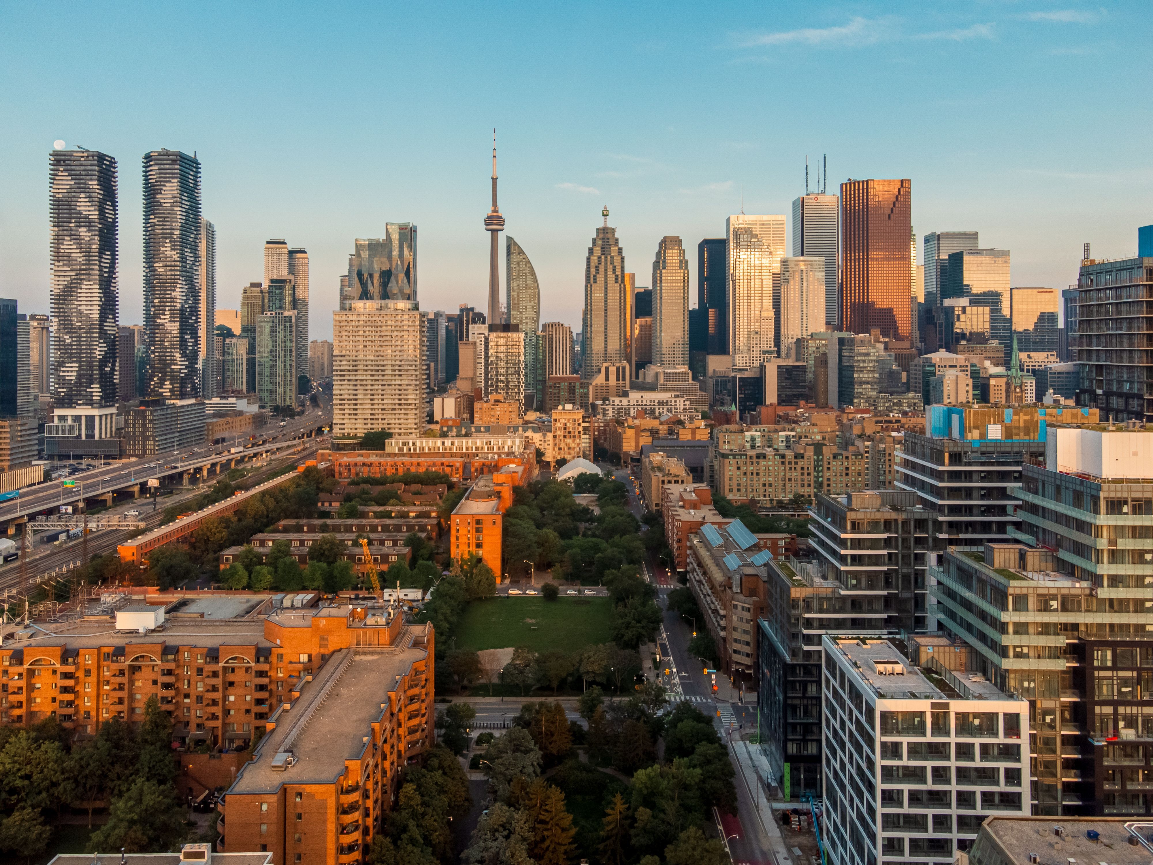 Toronto skyline with CN Tower at sunset.