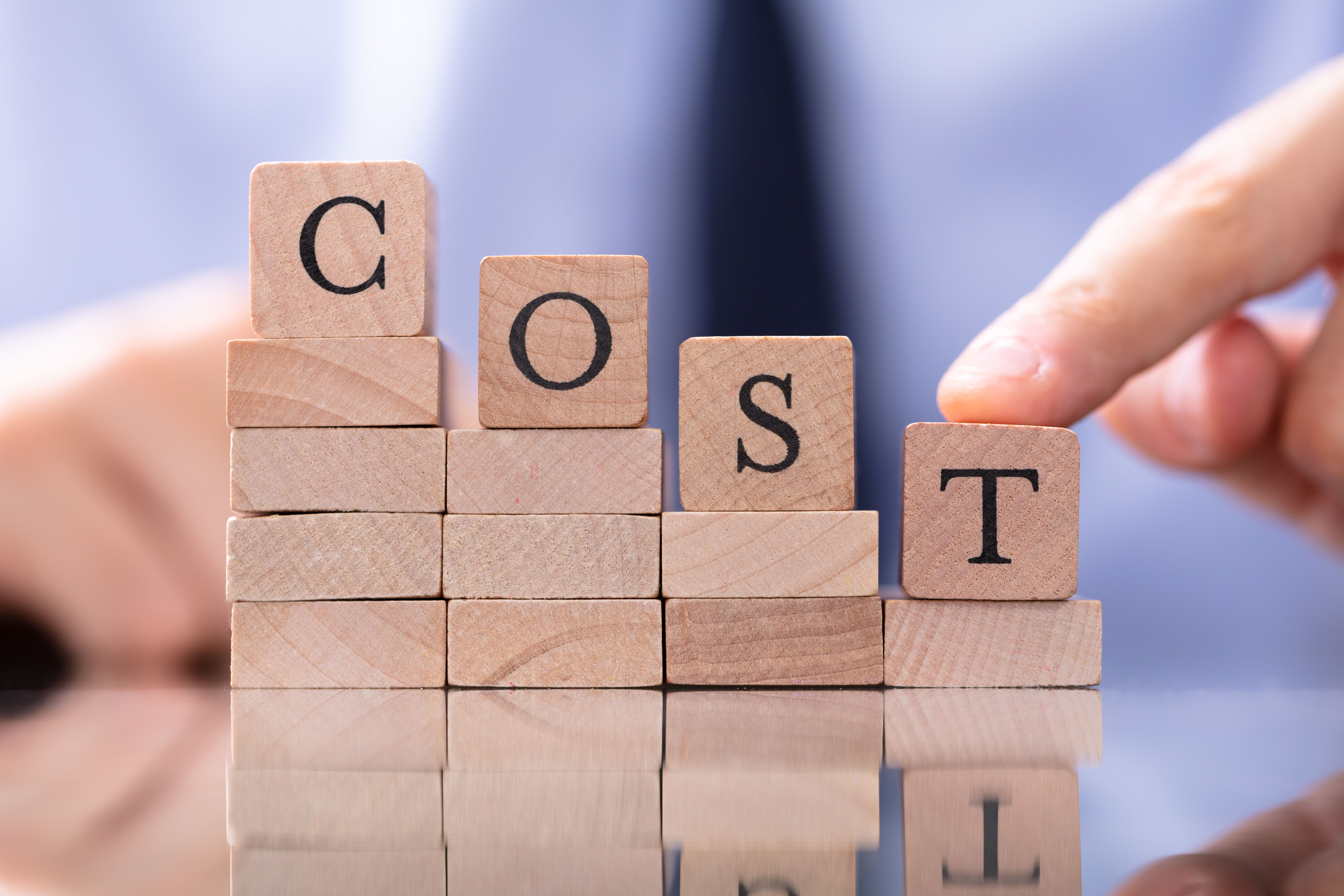 Spend Word With Declining Chart On Desk