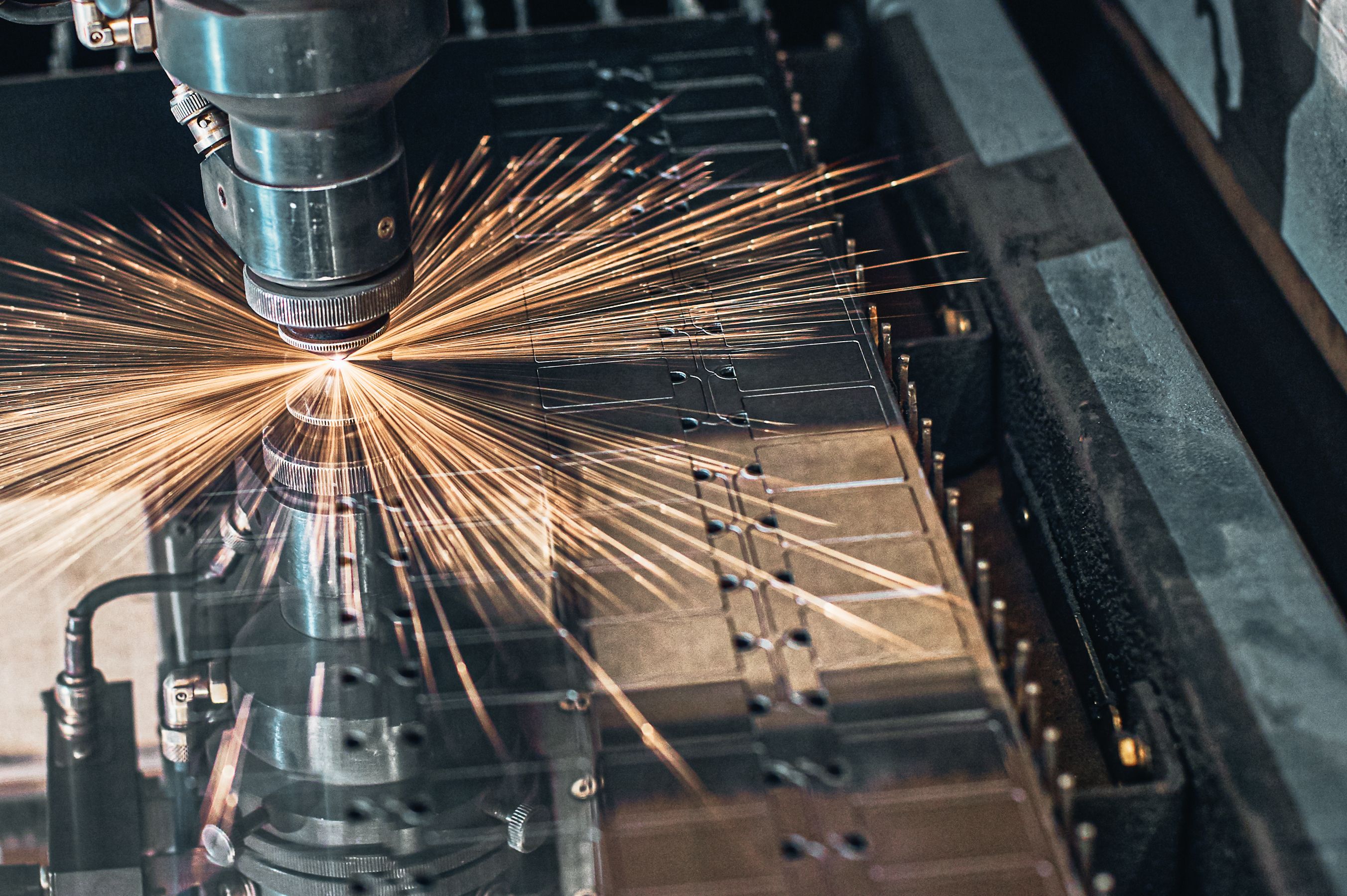 CNC Laser cutting of metal close up, modern industrial technology. Small depth of field
