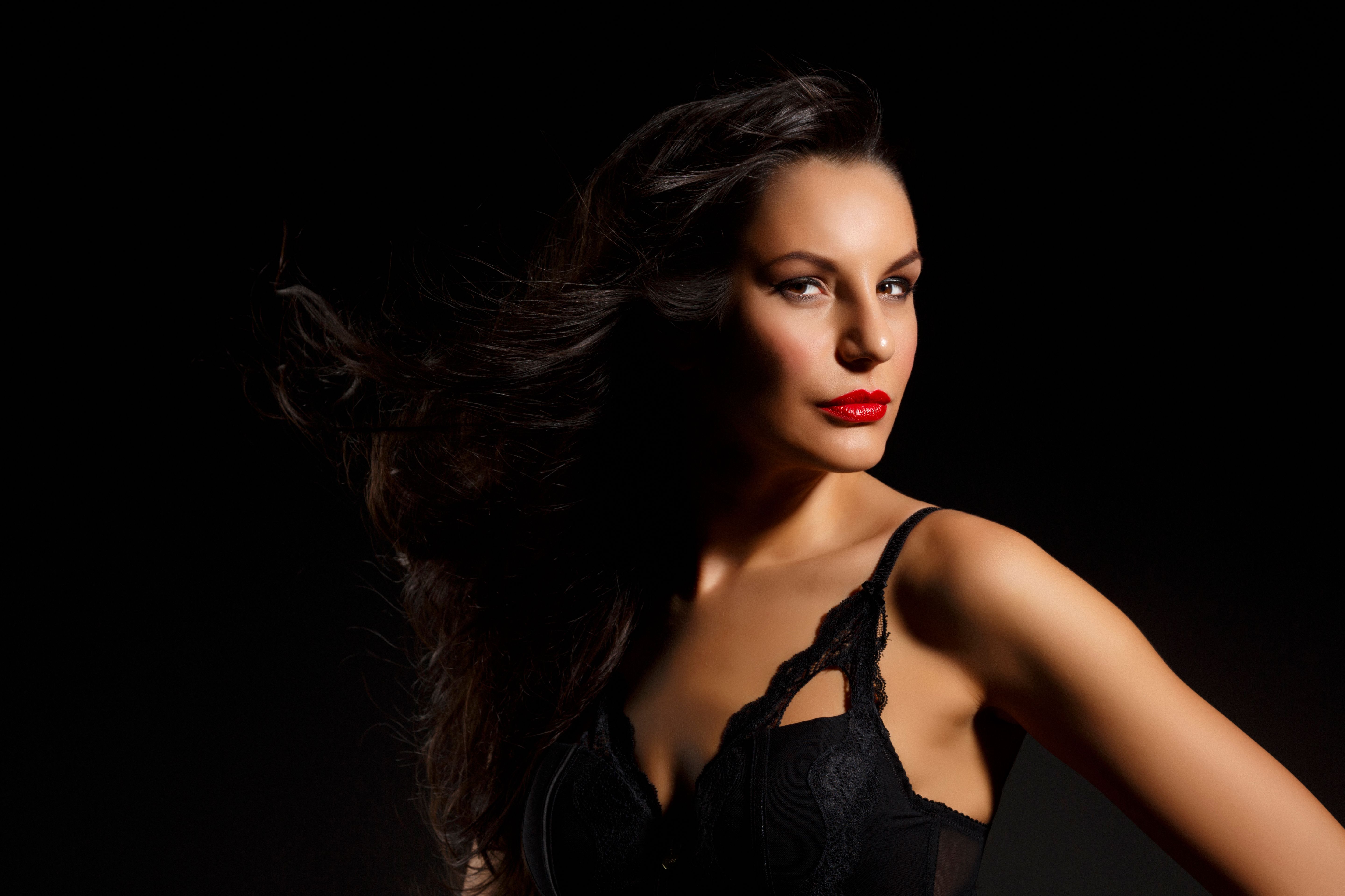 Beautiful mid adult women wearing black sexy lingerie    Gorgeous brunette