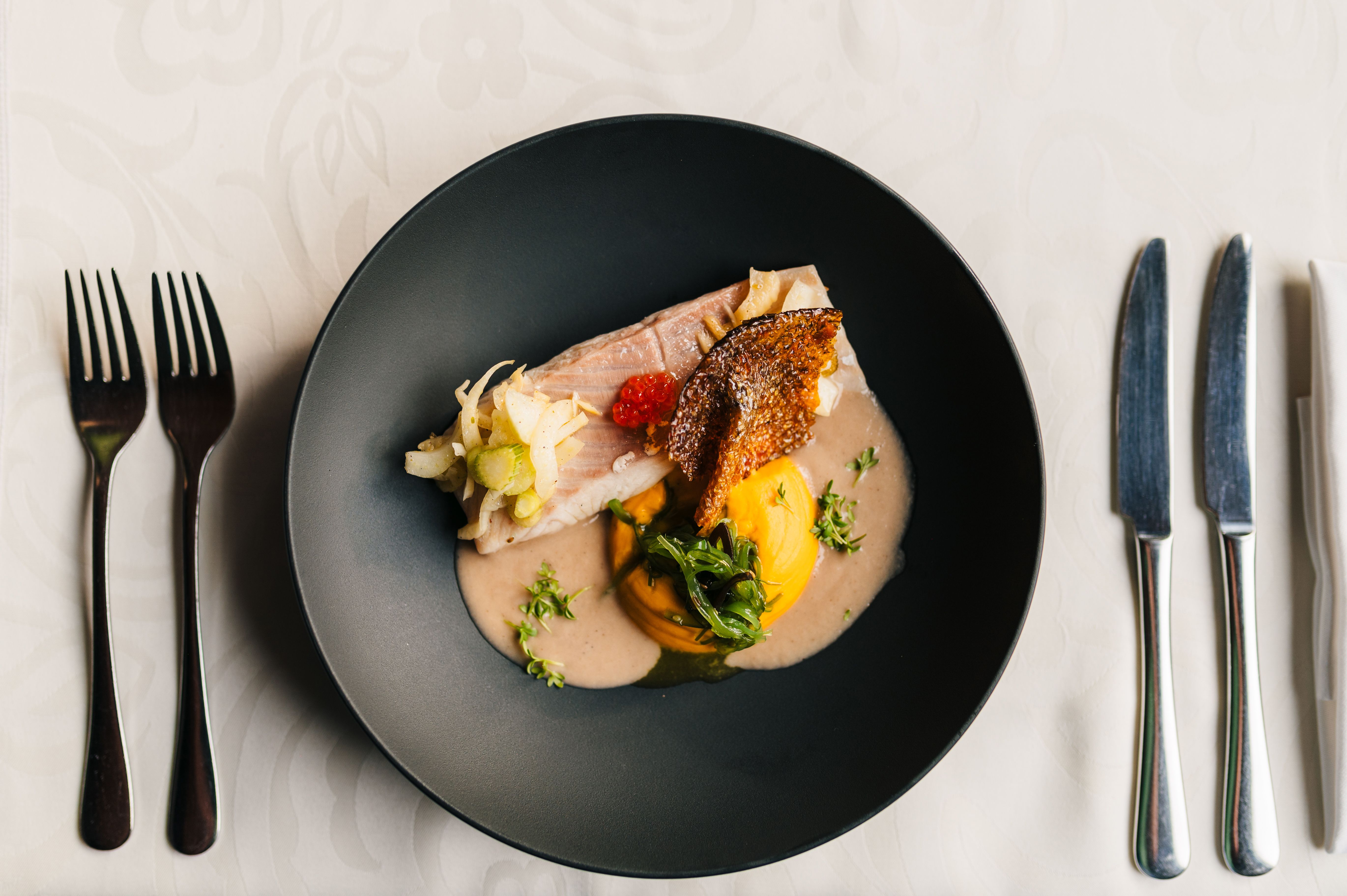 Fancy food with a Trout, pumpkin puree and seaweed