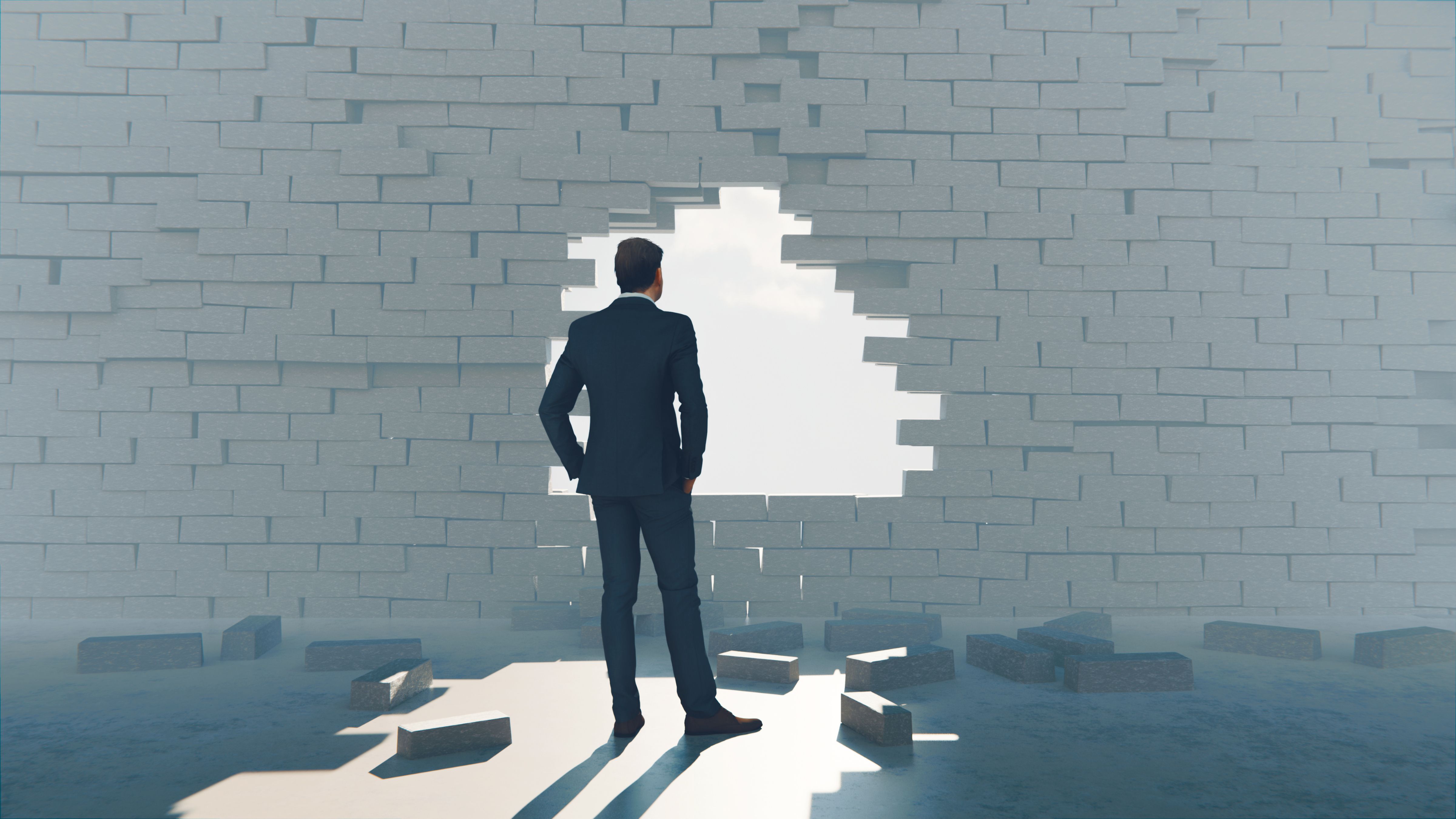 Breaking hole in a wall shows signs of hope and freedom Breaking hole in a wall shows signs of hope and freedom