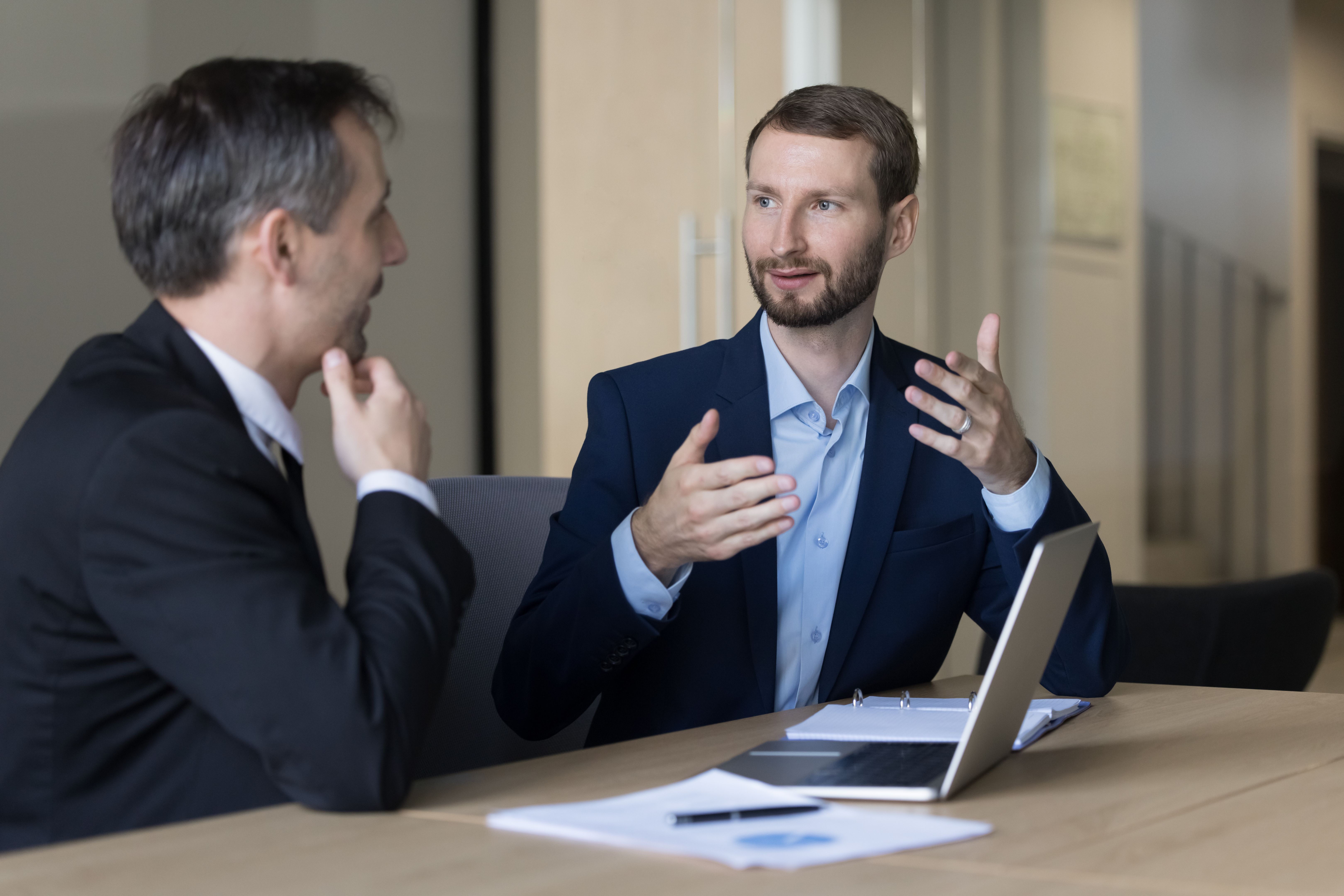 DFW business consultant reviewing financial reports to increase cash flow and profitability