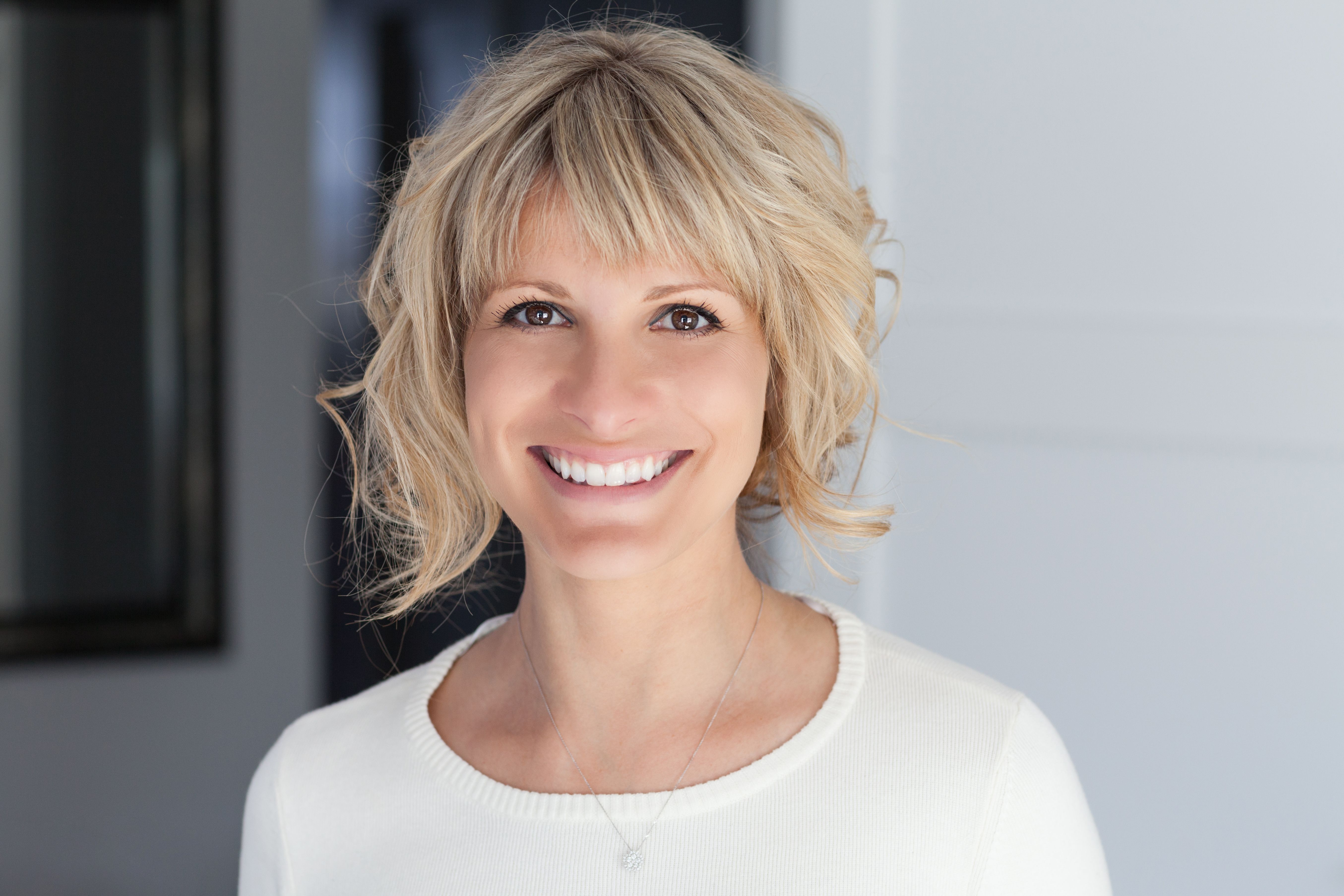 Portrait Of A Mature Woman Smiling At The Camera In the bedroom Portrait Of A Mature Woman Smiling At The Camera In the bedroom