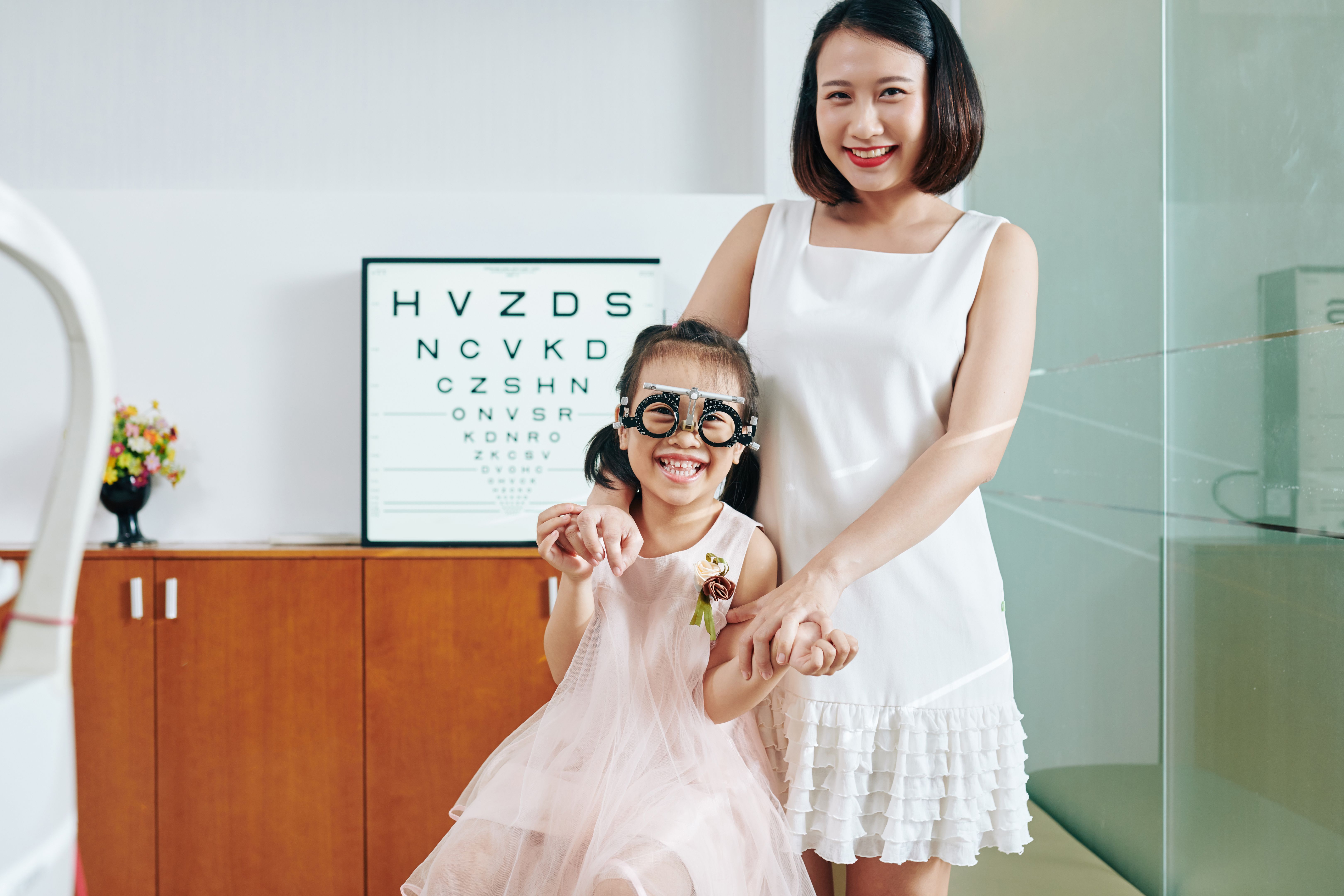 Mother and daughter visiting ophthalmologist