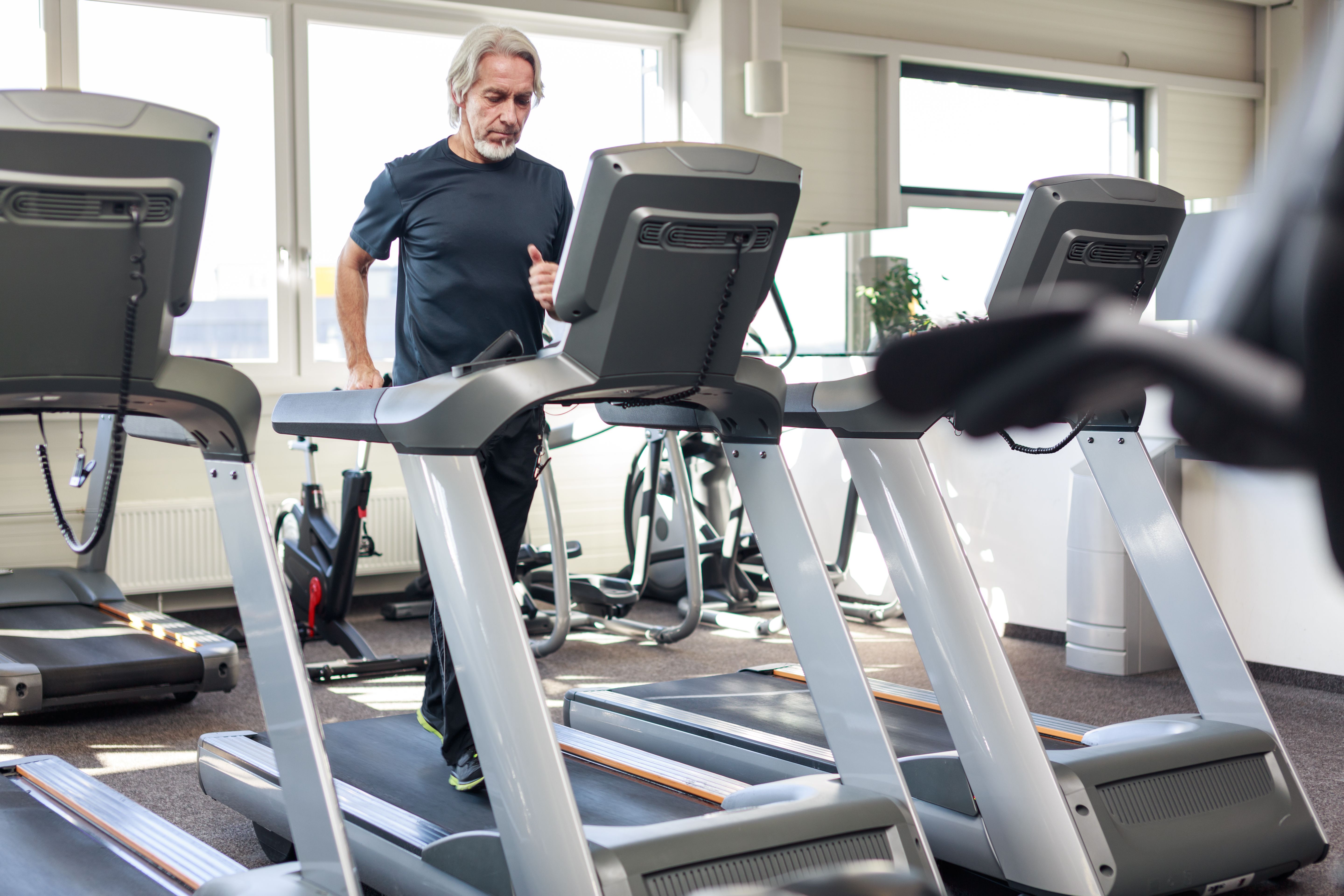 Senior Caucasian Man Working Out at the Gym