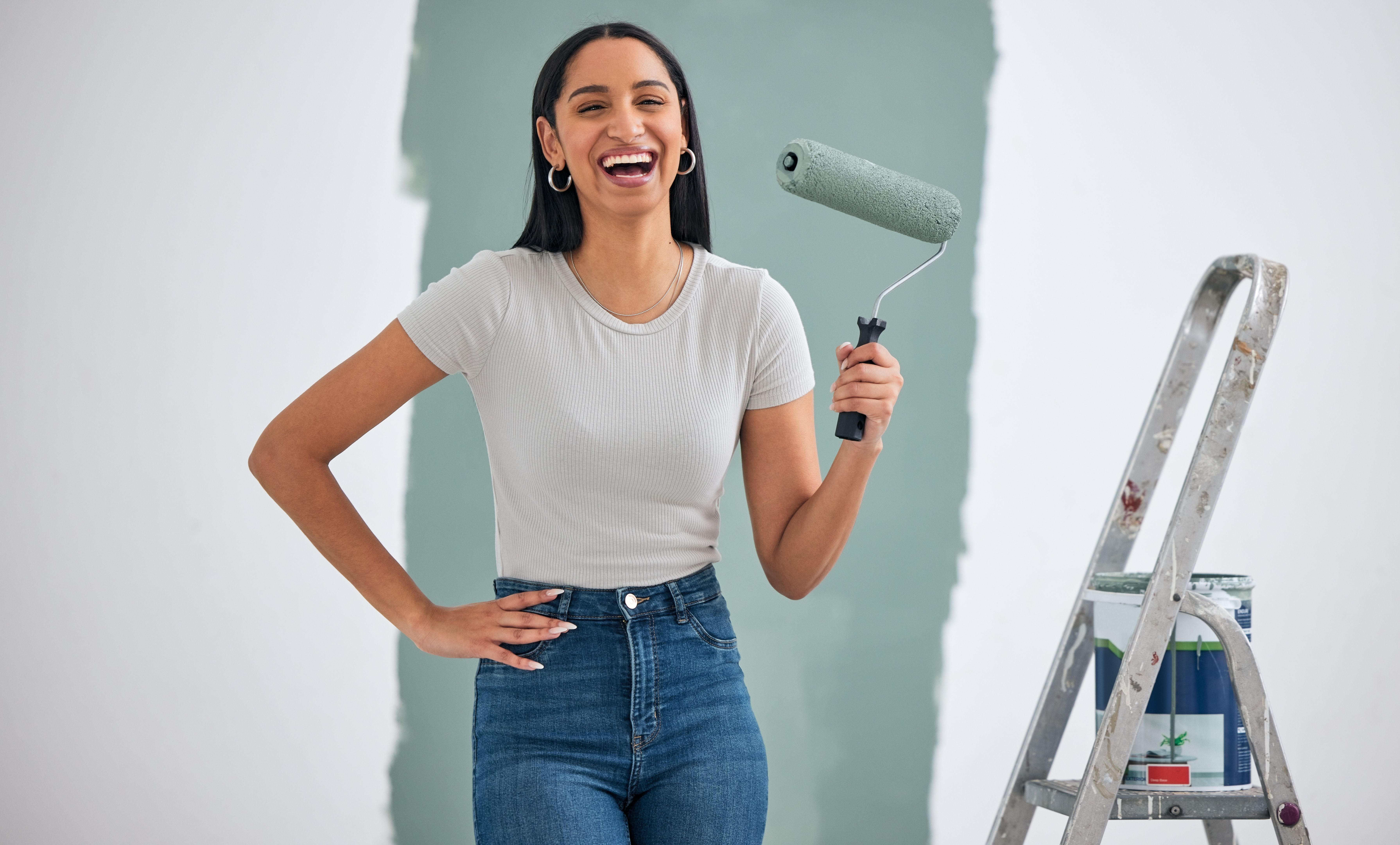 woman painting wall