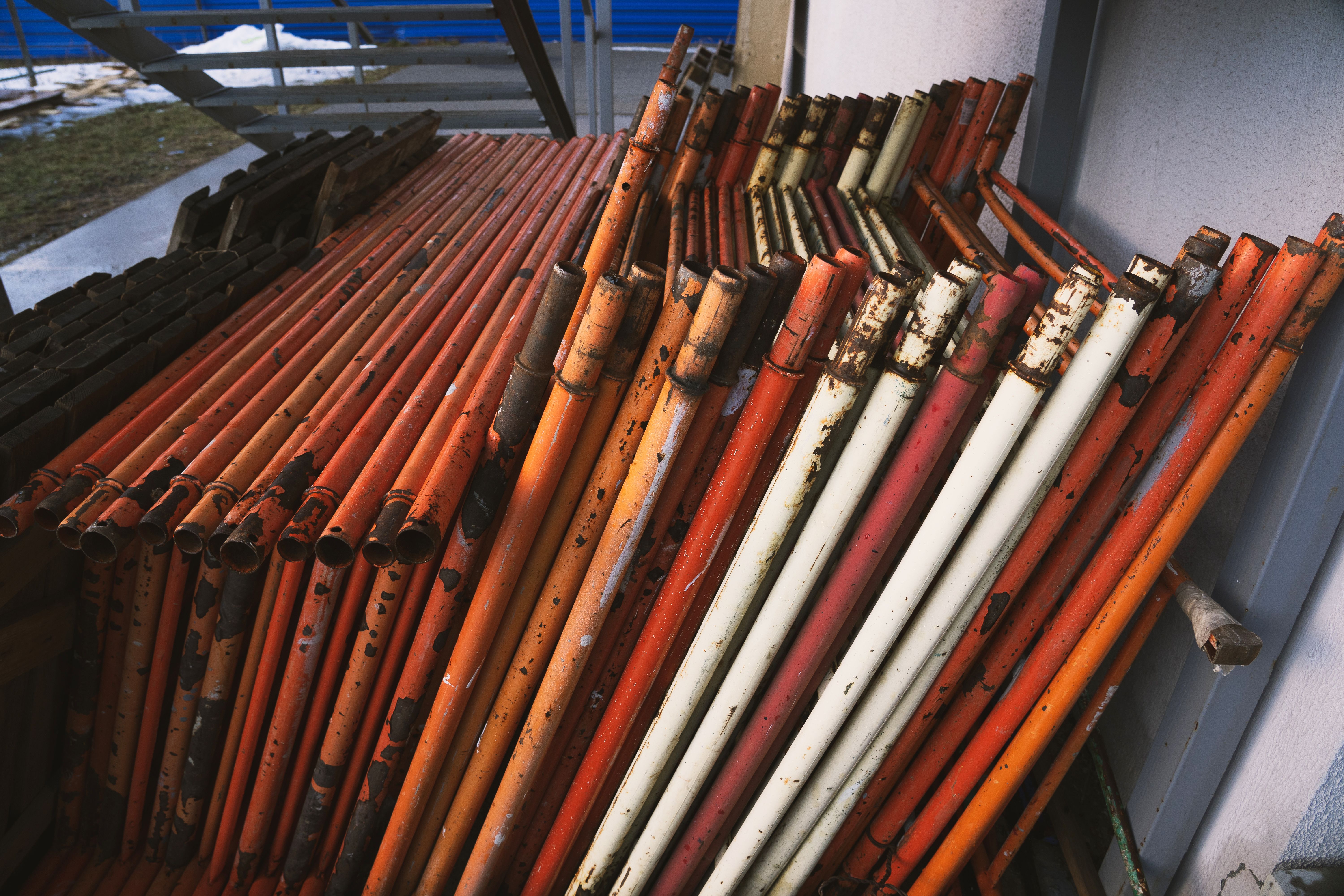 Dismantled scaffolding stacked neatly for storage