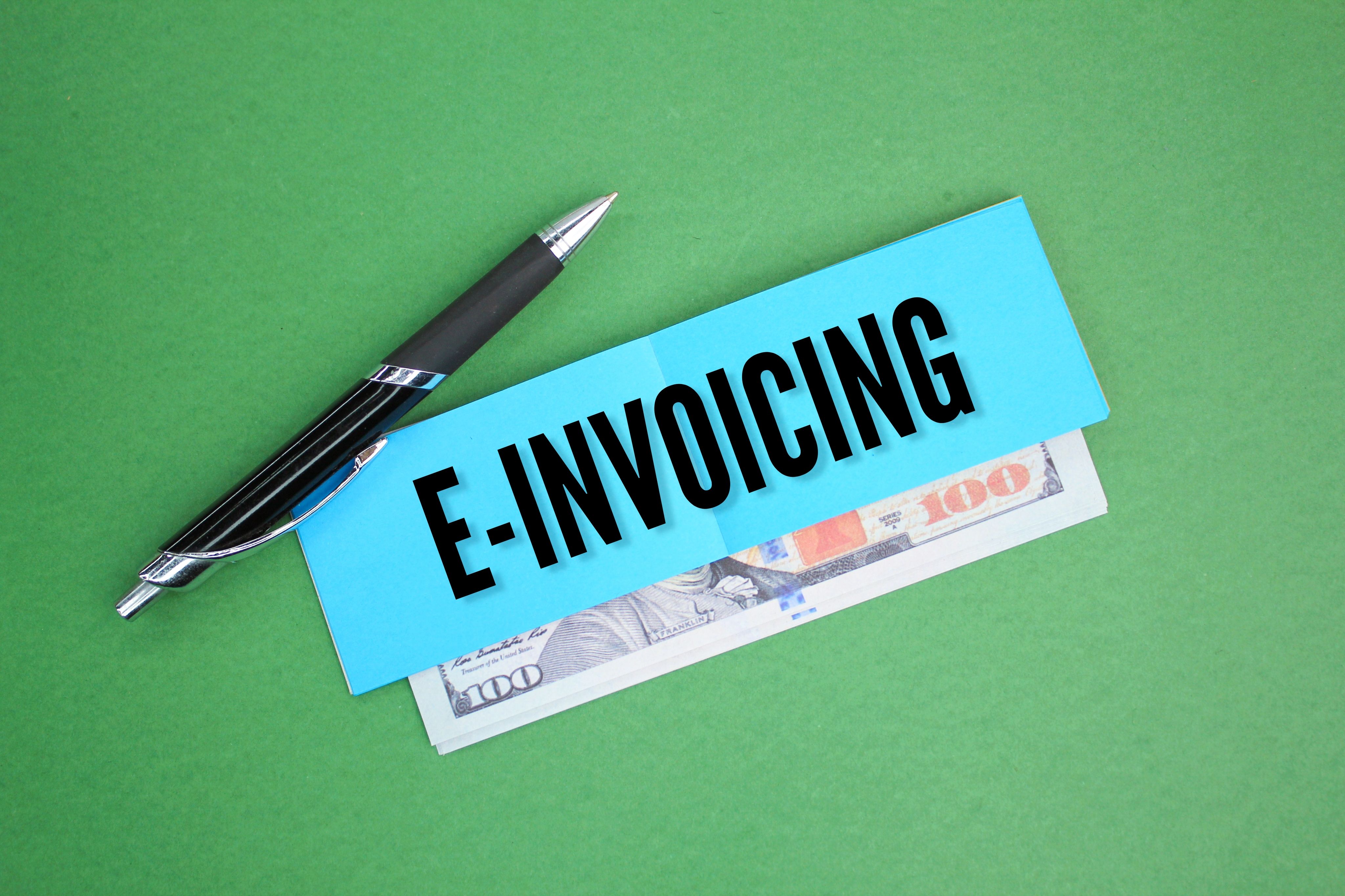 Pen with the word e invoicing or invoice. business record concept