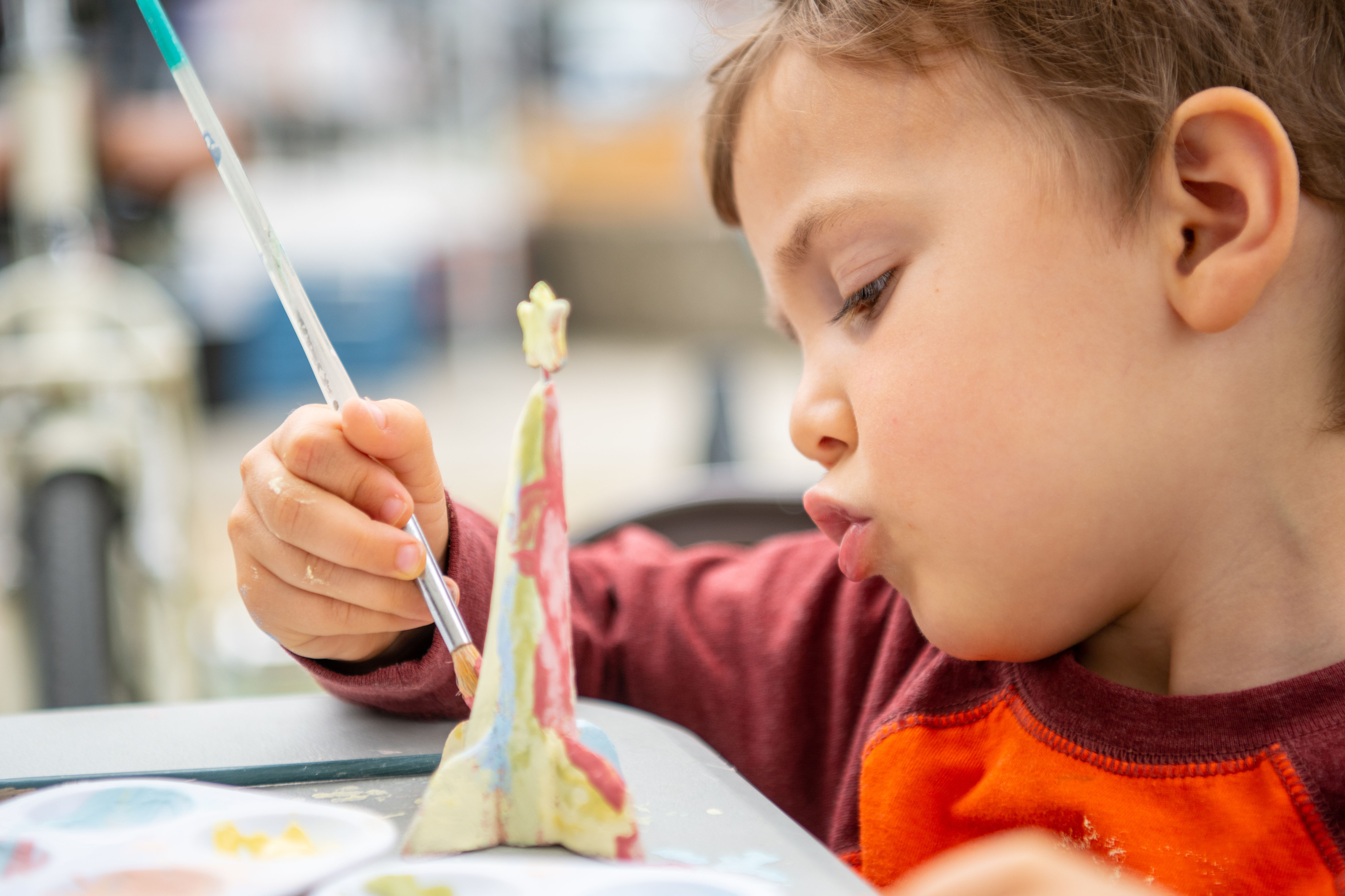 kids painting pottery